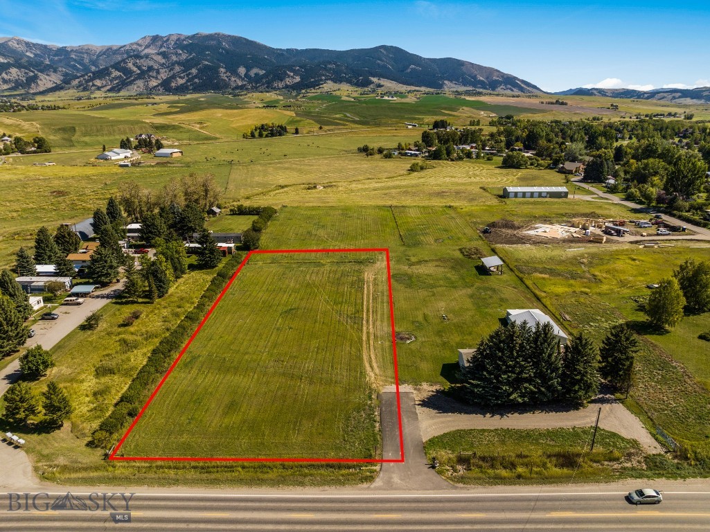 Secure your piece of Montana paradise in one of Bozeman’s most sought-after corridors. Located just over a mile down Springhill Road, this 1.556-acre parcel offers the rare combination of privacy, convenience, and true build-ready infrastructure, saving you months of time and upfront development costs.

The property features a fully approved 0.222-acre building envelope, with well and septic permits already in place, setbacks surveyed, and utilities, including power and natural gas - stubbed to the lot. The build envelope is flat, level, and ready for your custom home or home + shop.

Outdoor recreation is right at your doorstep with Sypes Canyon Trailhead nearby, East Gallatin River fishing access less than ½ mile away, and Riverside Country Club & Bridger Creek Golf Course just down the road.

Floodplain & Build Area Note:
A portion of the property lies within the 100-year floodplain, creating a natural greenbelt that enhances privacy and open space. The approved 0.222-acre building envelope is fully permitted for residential construction. Expansion beyond this footprint may be possible with a Gallatin County variance.

This is a rare, shovel-ready opportunity in the Gallatin Valley - offering views, utilities, permits, and location without the typical hurdles of raw land.