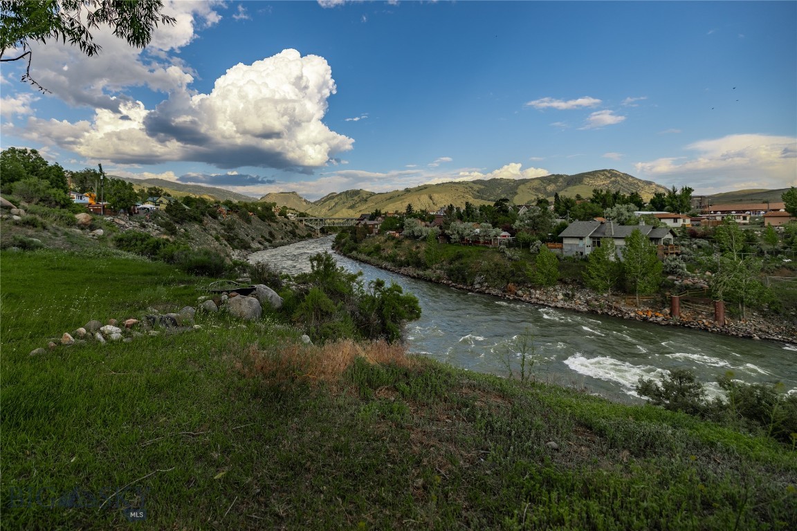 Discover an exceptional investment opportunity just steps from Yellowstone’s north entrance. Located less than five minutes from the park and a short walk from historic Main Street, this property offers breathtaking views and unmatched versatility.

Unrestricted by zoning, you have the freedom to bring your vision to life—whether that means building your dream home, establishing a boutique hotel, creating vacation rentals, or opening a restaurant or retail space. The property comprises four parcels bordering the Yellowstone River and includes 11 fully serviced RV sites. Additionally, the larger lot features a single-family home that has consistently generated income.

The residence is an eco-friendly green modular home—a two-bedroom, two-bath retreat powered by solar energy that has proven popular on Airbnb. Enjoy spectacular views of the Yellowstone River, the iconic Gardiner bridge, and the historic Roosevelt Arch, all while relaxing in a hot tub in a beautifully landscaped backyard.

Gardiner’s unique charm, coupled with its year-round open north entrance to Yellowstone National Park, attracts visitors throughout every season including winter adventurers and wildlife enthusiasts heading to Lamar Valley and Cooke City.

This property is a rare chance to invest in a slice of paradise where opportunity meets nature. To truly appreciate its beauty and potential, you must see it in person—photos simply can’t capture the full experience. Contact the listing agents today to schedule your tour and discover the endless possibilities awaiting you in this remarkable location.