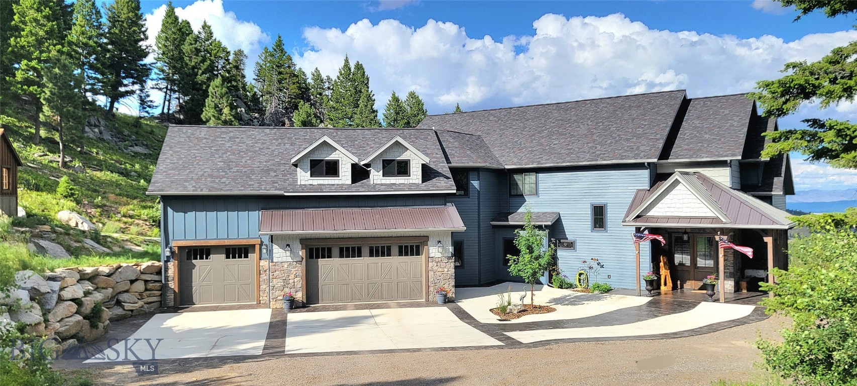 Nestled in the picturesque Boulder Mountain Range, this custom-built home is a testament to luxury living in Montana. With a unique style and location, the property offers a lifestyle defined by exclusive amenities and breathtaking surroundings. Situated at the end of the road near the mountain’s summit and bordered by BLM and Forest Service land on three sides, enjoy your own private outdoor haven with thousands of acres to explore. Abundant wildlife such as moose, deer, and resident elk, frequent the property.

Designed by the builder for his family, this meticulously crafted home, guest house, and shop balance luxury, efficiency, and detail, blending rustic Montana charm with modern finishes. The home offers 4,860± sf of main living space and a partially finished daylight basement with 2,840± sf of flexible space ready for your custom design.

The main level features a well-appointed kitchen, dining and living areas with see-through fireplace, master suite, den, full bath, laundry, mudroom, and large entertaining deck. Granite countertops, solid coffee-stained oak floors, maple cabinetry, built-ins, and straight-grained fir trim provide warmth and elegance. The primary suite includes his and her walk-in closets, oversized shower/spa room, jetted tub, and coffee bar, with a private balcony overlooking the valley and Elkhorn Mountain vistas.

The second level offers a spacious seating/TV area, bedroom with connected playroom and 3/4 bath, guest bath, second bedroom/office, craft room, and large bonus room, providing flexible space for family, guests, or hobbies. Additional features include an oversized 3-car heated garage with heated outdoor concrete for year-round convenience.

Just 15 minutes from Helena, enjoy urban amenities and the Helena airport, while Great Divide Ski Area is 45 minutes away. With access to Lewis & Clark National Forest for skiing, snowmobiling, fishing, hiking, hunting, and ATV riding, this property offers more than a residence—it provides a luxury Montana lifestyle enriched by nature, adventure, and convenience.