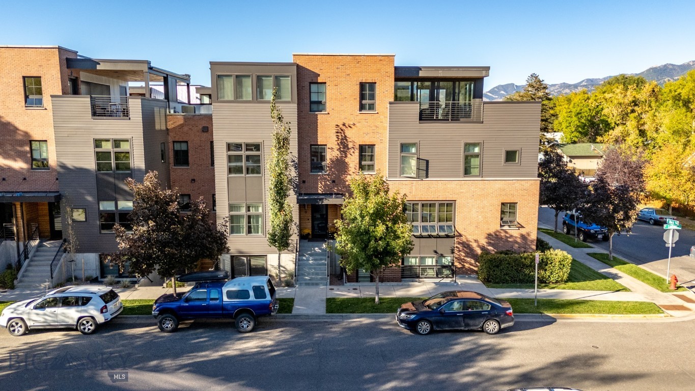 ?Welcome to your Block M townhouse, just two blocks north of Main Street! Completely remodeled with elevated design and high-end finishes, this home blends luxury with convenience in one of the city’s most coveted locations. Ride your personal elevator from the lower-level garage up through three thoughtfully designed floors, all the way to your private penthouse retreat—complete with a hot tub and sweeping Bridger Mountain views. The entry level offers a serene master suite with a walk-in closet and spa-like ensuite bath, plus a guest bedroom, additional bathroom, and a versatile den. Upstairs, the second floor showcases a stunning remodeled kitchen with abundant cabinetry and an expansive open layout that seamlessly connects to the living and dining areas—perfect for entertaining. A light-filled loft occupies the next level, where panoramic windows frame the Bridger's and doors open to your private patio and hot tub. On the lower level, a separately metered, fully furnished studio apartment offers flexibility for guests or rental income. The location is truly unmatched—walk or bike to downtown shops, coffee, restaurants, grocery stores, parks, and trails. At the same time, enjoy the privacy and retreat-like feel of your own home. Whether as a primary residence, investment opportunity, or second home, this property delivers the Montana lifestyle with ease