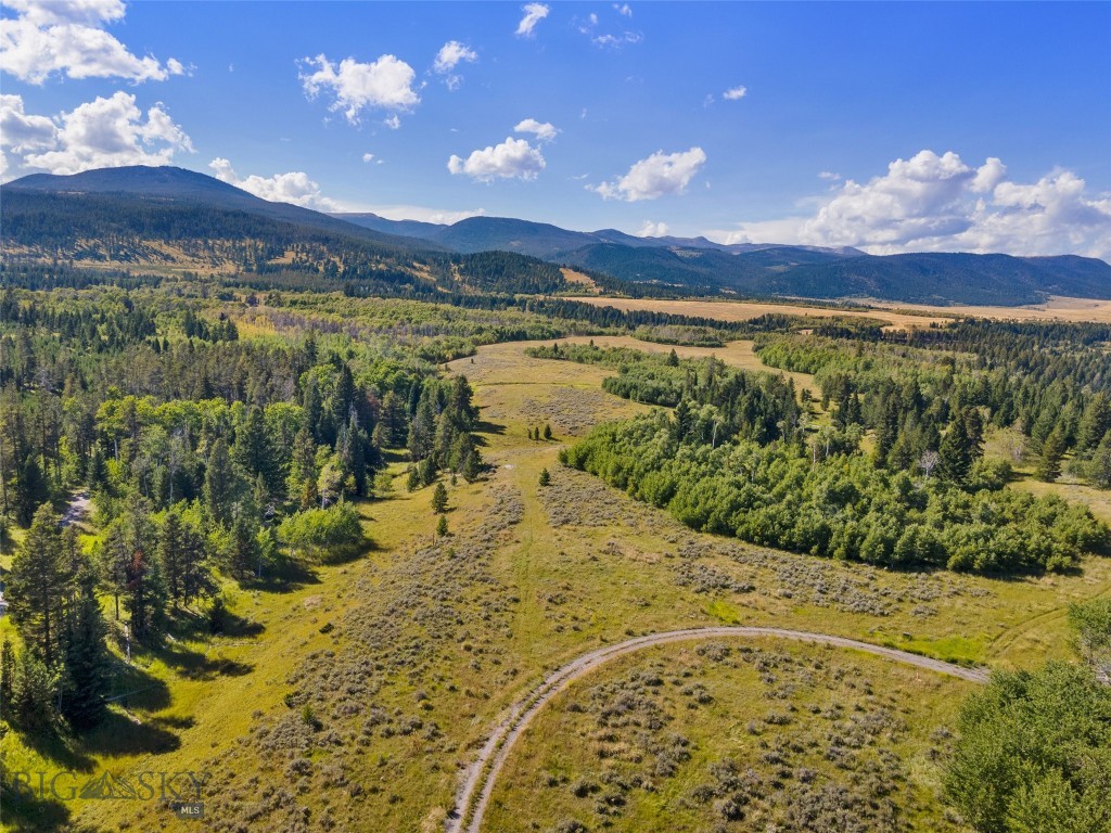 This pristine lot in the upper meadow of Sun West Ranch features gently sloping fields of wildflowers and native grasses to go along with groves of aspen and pine trees. Enjoy dramatic panoramic views of the Madison Range to the east and the Gravelly Mountains to the west. Sun West Ranch offers many services to its owners, including 24-hour management and gated entry. There are only 55 exclusive homesites, stocked ponds, 3 miles of Madison River flowing through the Ranch, 1600 acres of open space including miles of trails for hiking, biking, and horseback riding, and private access to Bureau of Land Management land for hunting. There is also an equestrian center with a barn and corrals. Sun West Ranch is situated between Yellowstone National Park and Ennis, MT. This is the perfect community to enjoy the true modern Montana lifestyle! Call us or your favorite Realtor to schedule a tour!