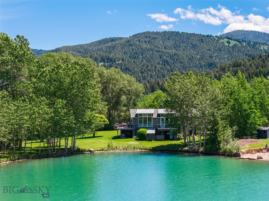 Experience the best of Montana living in this beautiful home set on 2.1 private acres,
complete with exclusive access to Mystic Heights pond. Surrounded by mature
landscaping and towering trees, this property offers both privacy and breathtaking
scenery, with stunning views of the Bridger Mountains.
Located just 6 miles from downtown Bozeman and only 45 miles from the world-class
skiing at Big Sky, this home perfectly balances convenience and outdoor adventure.
Inside, you'll find a spacious 4-bedroom, 5-bath layout featuring an open-concept
iving, dining, and kitchen area. Fioor-to-ceiling windows flood the space with natural
light while perfectly framing mountain views to the north and the aid pond to the west.
The walkout basement includes a private guest or in-law apartment, complete with a
large living area and fireplace, one bedroom, one bathroom, a full kitchen, and patio
doors that open toward the pond— ideal for guests or multi-generational living.
This is your opportunity to make your Montana dream a reality. Schedule your private
showing today.