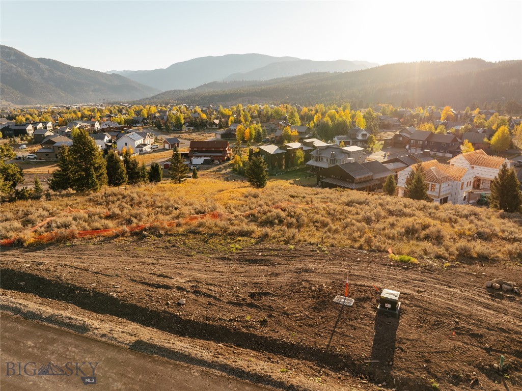 Perched above the Meadow, homesite 16 offers a stunning vantage point within the Upper Whitefish neighborhood. Spanning 0.28 acres, this elevated lot captures sweeping, panoramic mountain views of the Gallatin mountain range and a true bird’s-eye perspective, making it a standout opportunity in Big Sky. The setting is breathtaking and scenic, ideal for a thoughtfully designed mountain home that embraces the surrounding landscape. Complete with the opportunity to have an accessory dwelling unit, allows for flexible living areas, or a potential rental.
Upper Whitefish has been carefully curated for the nature enthusiast, with 26 homesites woven throughout sagebrush hills, open meadows, and stands of pine. A private trail for hiking, biking, and cross-country skiing connects seamlessly to Big Sky’s greater trail system, offering direct access to year-round recreation. With convenient proximity to Town Center and expansive mountain views in every direction, Lot 16 presents a special opportunity to experience the essence of Big Sky living.