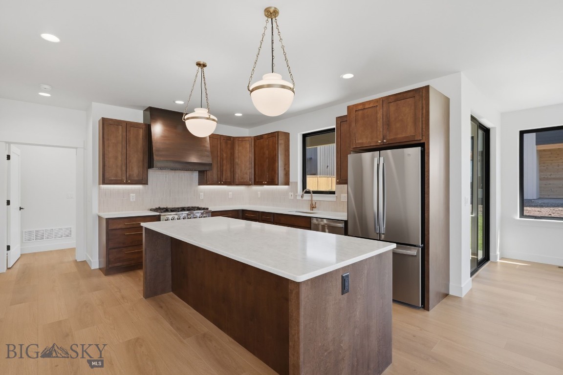 Discover this thoughtfully designed new construction home in the Sierra Vista neighborhood, offering 2,983± sq ft, a 3-car garage, 4 bedrooms, 2.5 baths, and a spacious bonus room. The main level features an open-concept layout centered around a well-appointed kitchen with quartz countertops, stainless steel appliances, and a custom built-in vent hood. The living room is bright and inviting with abundant natural light and a sleek linear fireplace, while the dining area opens directly to a covered back patio—ideal for easy indoor-outdoor living.
The main-level primary suite offers a comfortable retreat with a tiled walk-in shower, freestanding soaking tub, private water closet, and a large walk-in closet. Upstairs, you’ll find three additional bedrooms, a full bathroom, and a generous bonus room that works well as a media space, playroom, or home office.

With a functional layout and quality finishes throughout, this home is ready to fit a variety of lifestyles—schedule your showing to see it in person.
