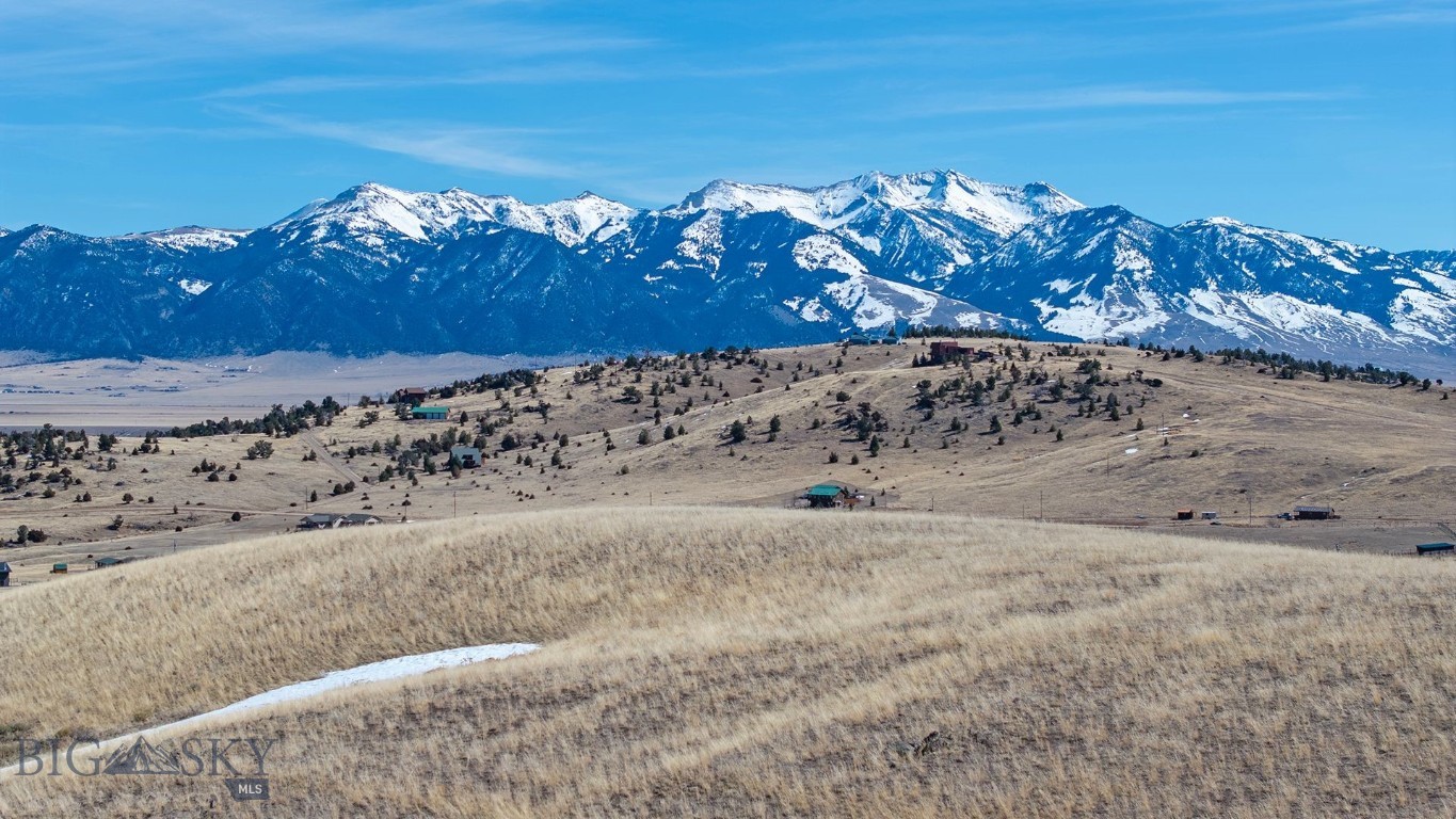 This 11.48± acre parcel offers access to Haypress Lakes and Axolotl Lakes, just minutes from Varney Bridge and the famous Madison River. With plenty of recreational opportunities, bring your ATVs, or horses and enjoy your very own Montana playground. Only 15 minutes from the quaint western town of Ennis, this spacious property provides endless building possibilities—perfect for crafting your ideal Montana retreat. Whether you envision a cozy cabin or a custom ranch home, this land offers the privacy and natural beauty that define Big Sky Country. Don’t miss your chance to own a true slice of Montana paradise. This parcel is partially fenced and agent owned.