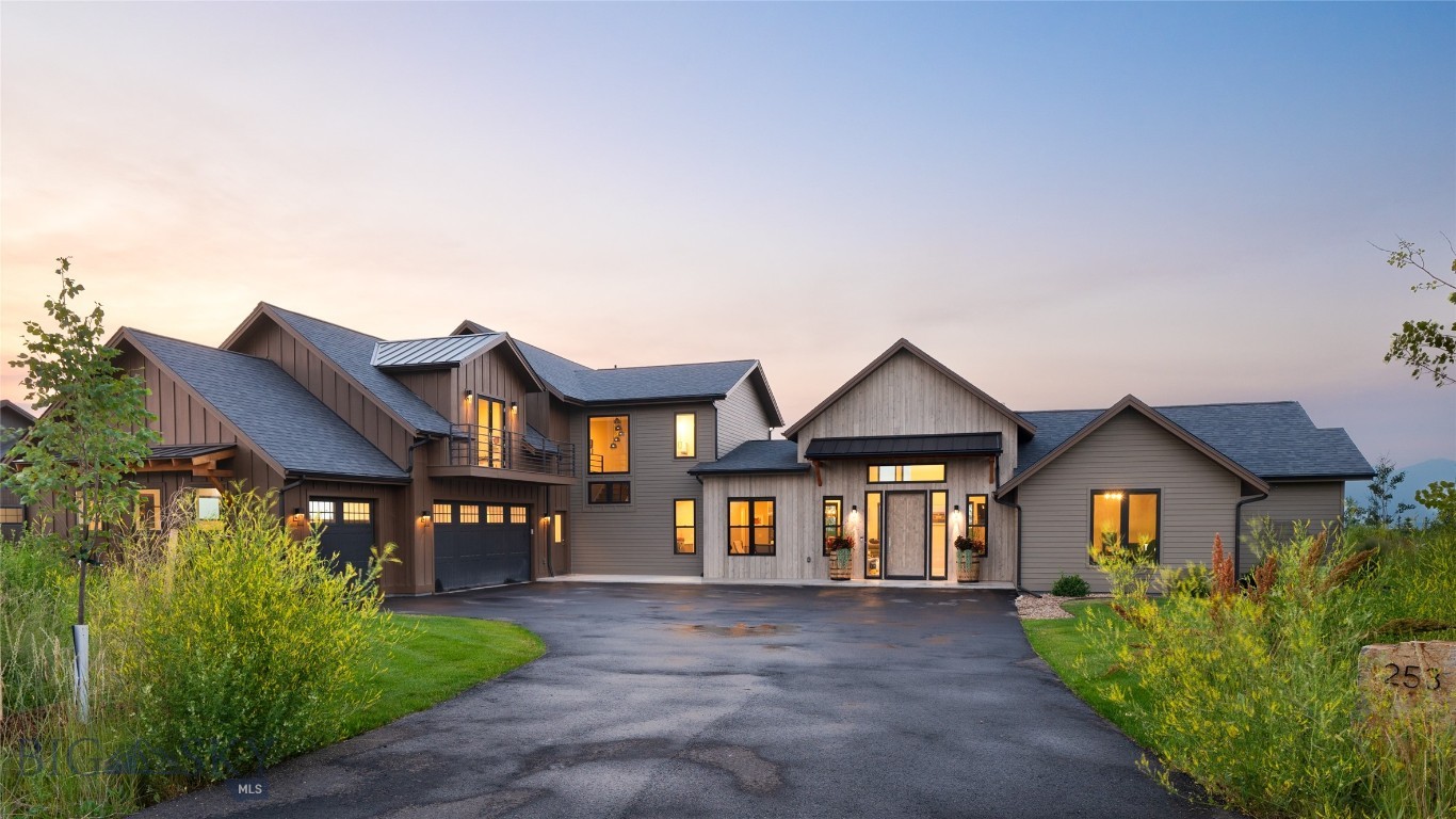 Set on a private acre within Home 40 Subdivision, this 2021 five-bedroom home was built with the kind of care that shows up in the details — thoughtful layout for maximum functionality, quality finishes, and a dedicated home office that means work-from-home actually works. Unobstructed Bridger Mountain views carry through every level, and the neighborhood's trail system starts at the property line. The main floor is organized around an open kitchen with professional-grade appliances, a huge walk-through butler's pantry, and an oversized island — all of it flowing into a vaulted living room with gas fireplace and mountain views that don't quit. The main-floor primary suite is a genuine retreat, with a well-appointed ensuite and easy separation from the rest of the house. A guest bedroom and bath tucked on the opposite end of the main floor offer real privacy, alongside a home office, dedicated laundry room, generous mudroom, and powder room with shower that round out the level with the kind of practical flow that makes daily life feel effortless. Upstairs, three more bedrooms, two bathrooms, and a generous bonus room with balcony offer room to spread out. Step outside and the setting delivers. Multiple patios and the upper balcony frame views of the community pond and surrounding mountains, with a hot tub for soaking year-round. The heated, finished three-car garage is oversized with storage to match. Home 40 adds its own appeal — scenic ponds, over three miles of trails, a community center, fitness facility, and outdoor pool, all within the neighborhood. Minutes to Hyalite Canyon, ten minutes to downtown Bozeman, under an hour to Big Sky. In summary, five bedrooms, five bathrooms, a home office, 3-car garage, and hot tub - hard to improve on this one!