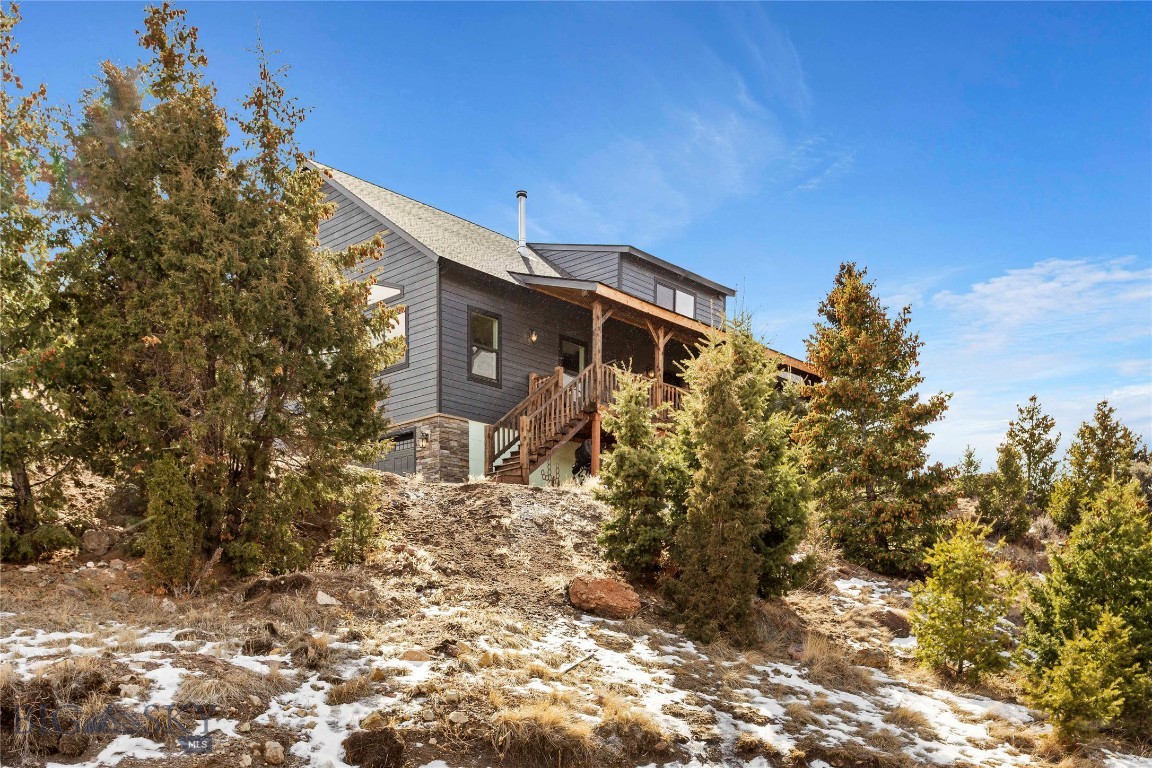 PRICE REDUCED $40K!! - Motivated Seller.  Must See...One of the newest premiere homes and lot combinations in Flint Creek Ranch has come to market! Owners are moving! This spacious country home with luxurious updates sits on top of 20.64 acres and was constructed only a few years ago with quality and family in mind. It encompasses 4 bedrooms or 3 bedrooms with an office, along with 3 baths and a modernized bright and open kitchen plan with a spacious deck/porch in the front. This makes for some beautiful views and sunsets without noise and neighbors and a peacefulness that only large acreage home sites can provide. For those of you that need some extra space outside of the living area, the 3 Car Heated Garage is a rare addition!  Private Well with some of the best quality water in the county along with Vigilante Coop as your low cost electric power supplier. In floor heat and so much more... Schedule your showing
