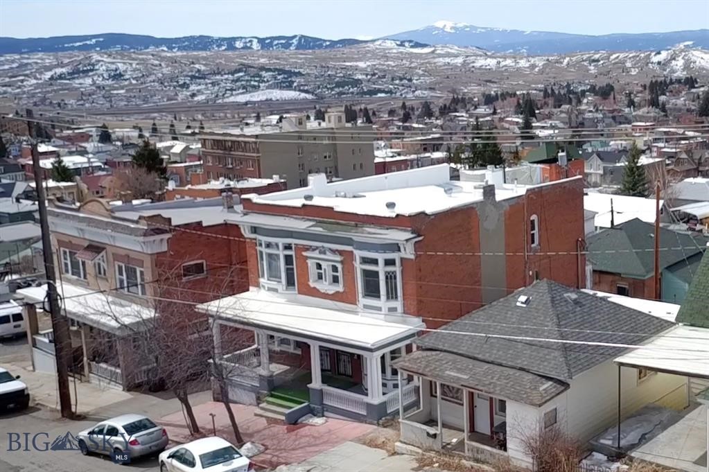 Annual gross rental income = $ 61,800. Cap Rate 6%. Newly and extensively renovated, including the systems, the pictures and attached video of the interior and exterior tell the story. The brick building has some special architectural features. The property has two buildings with a total of four units. Three units are the two-story brick building and the fourth unit is in a separate house. All units are currently rented. Two of the units in the brick building have 3 bedrooms and 1 1/2 bathrooms and the third unit has a 2 bedrooms and 1 bathroom. The unit in the house is 2 bedroom and 1 bathroom. See the rental income per unit in financial information section of this mls listing. Tenants pay electric and natural gas. Units have their own laundry. Property is conveniently located in Uptown Butte. If you are looking for a turn-key income producing property you must check-out this one out.