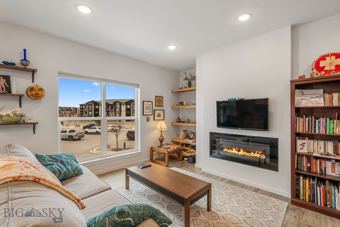 You'll love this spectacular 2 bedroom, 2 bath condo in the desirable Centre Park Flats complex. The central location is in walking distance to trails, shopping and dining along the 19th ave corridoor and just a short drive to downtown Bozeman. This well cared 1,080 sq ft property features an open floorplan that both lives and entertains well. Enjoy the spacious kitchen with large island, quartz countertops, solid wood cabinetry, big pantry and stainless steel appliances.  This great kitchen interacts well with the living and dining areas.  The living room features built in cabinetry and a fireplace to cozy up to on those cool Montana evenings.  The primary suite is spacious and has a large bath with tiled shower and dual vanities with quartz countertops and a walk in closet.  Down the hall is an additional bedroom that is perfect for guests and/or a home office.  There is another full bath with tiled floors and quartz countertops.  The large covered deck is the perfect outdoor space with views of the Bridger Range and adjacent Rose Park that features a public disk golf course.  The covered deck are also includes a storage closet that is great for skis/snowboards and other gear.  This unit is really trimmed out well with a "mini split" AC unit for those warmer summer days, in unit laundry room with washer/dryer, maintenance free vinyl plank floors and designated parking space.  This property is turn-key and move in ready.  Enjoy modern living in this great central Bozeman location!