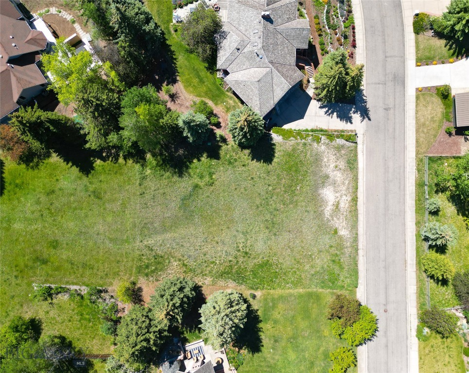 This .41-acre lot is situated to take in stunning mountain views and offers a rare opportunity to build in one of Bozeman’s most established neighborhoods. One of the last available lots in this highly sought-after subdivision, the property is ideally located near MSU, Bozeman Deaconess Health, Peets Hill, Valley View Golf Course, highway access, and just minutes from downtown Bozeman. Enjoy easy access to trails, recreation, dining, shopping, and everyday amenities while taking advantage of the incredible views and unbeatable location. Surrounded by established homes in a mature neighborhood, this homesite offers a rare combination of location, views, and convenience—whether you're ready to build now or planning for the future.