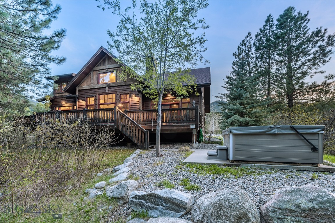 Crooked Canyon Lodge is a premier riverfront retreat on the Gallatin River. Ideally located between Bozeman and  BigSky with views of Storm Castle Peak and direct access to world class fly fishing.
The 3501 square-foot home offers four bedrooms, 3 1/2 baths, plus additional accommodations in the loft and den.  The main level primary suite opens to the spacious deck with the hot tub overlooking the river. Upstairs features two bedrooms with a shared bath, plus bunk room with two sets of bunks. The chef's kitchen is both elegant and functional showcasing granite countertops, premium stainless steel appliances, a walk-in pantry, and an inviting island for gathering. Enjoy indoor dining or outdoor entertaining with built-in gas grill and seamless access to the river via private trail. The stretch of water featured in 'A River Runs Through It' offers a rare blend of cinematic beauty and world-class angling. Set on 1.5 acres within walking distance to the Gallatin National Forest with private trail to the river.  Big Sky and Yellowstone National Park are a short drive away, ideal for fishing recreation or Montana getaway.