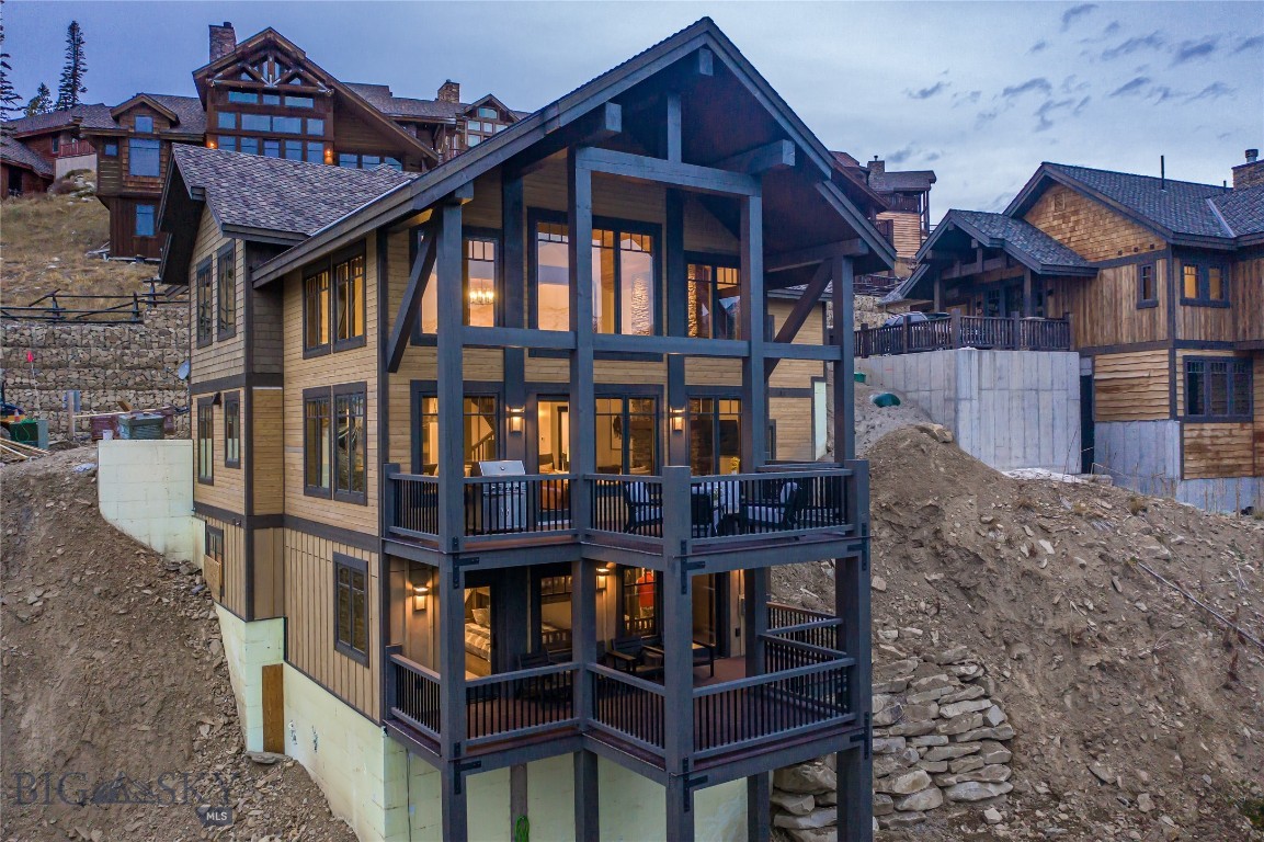 This end of the road Red Rock home is located directly on the ski trail in the popular Cascade Ridge neighborhood in Big Sky. This ski-in/ski-out home offers 6 bedrooms, 6.5 baths, and a large media room in 4354 square feet. This custom built property boasts high-end finishes throughout, radiant in-floor heat, a gourmet kitchen, vaulted ceilings, 2 spacious decks, 2 fireplaces, large windows throughout, and a 2 car attached garage. Home includes partial ownership of the gorgeous Cascade Ridge lodge, which offers a pool, hot tub, workout facility, game room and more! Ski-in/ski-out from the lodge!! Photos are of comparable, completed unit.