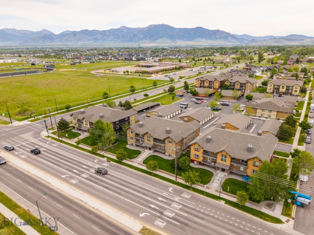 Set in one of Bozeman’s most convenient west-side locations, this beautifully refreshed condo offers easy access to Meadowlark Elementary, Chief Joseph Middle School, Gallatin High School, and nearby parks and trails including Gallatin County Regional Park, Bozeman Sports Park, and the neighborhood pond and trail system just steps away. Residents enjoy access to an on-site fitness room, first-come, first-served covered carports, and a detached one-car garage for added convenience and storage. With Bridger Mountain views from the private deck and a location close to shopping, dining, and everyday conveniences, this home blends lifestyle and accessibility in all the right ways.
Filled with natural light, the interior features a colorful yet refined aesthetic, tall ceilings, and thoughtfully sized living spaces throughout. The living room centers around a cozy gas fireplace, while the adjacent dining area and kitchen create an easy flow for entertaining or everyday living. Recent 2025 upgrades include new interior paint, updated light fixtures, new countertops in the kitchen and bathrooms, updated trim, backsplash, sinks, faucets, garbage disposal, toilets, and new Marmoleum bathroom flooring with cork underlay—bringing a fresh, modern finish to the home while preserving its warm, inviting character.
The spacious bedrooms offer excellent natural light, including a primary suite complete with an en suite bathroom. Impeccably maintained and lightly lived in, this condo served primarily as a seasonal vacation home from 2009 through 2023 and was occupied only a few months each year. The result is a home that feels remarkably well preserved and truly move-in ready. Whether you’re searching for a low-maintenance primary residence, a lock-and-leave Montana getaway, or an investment property with rental potential, this exceptionally maintained condo presents a rare opportunity in one of Bozeman’s most convenient and connected locations.