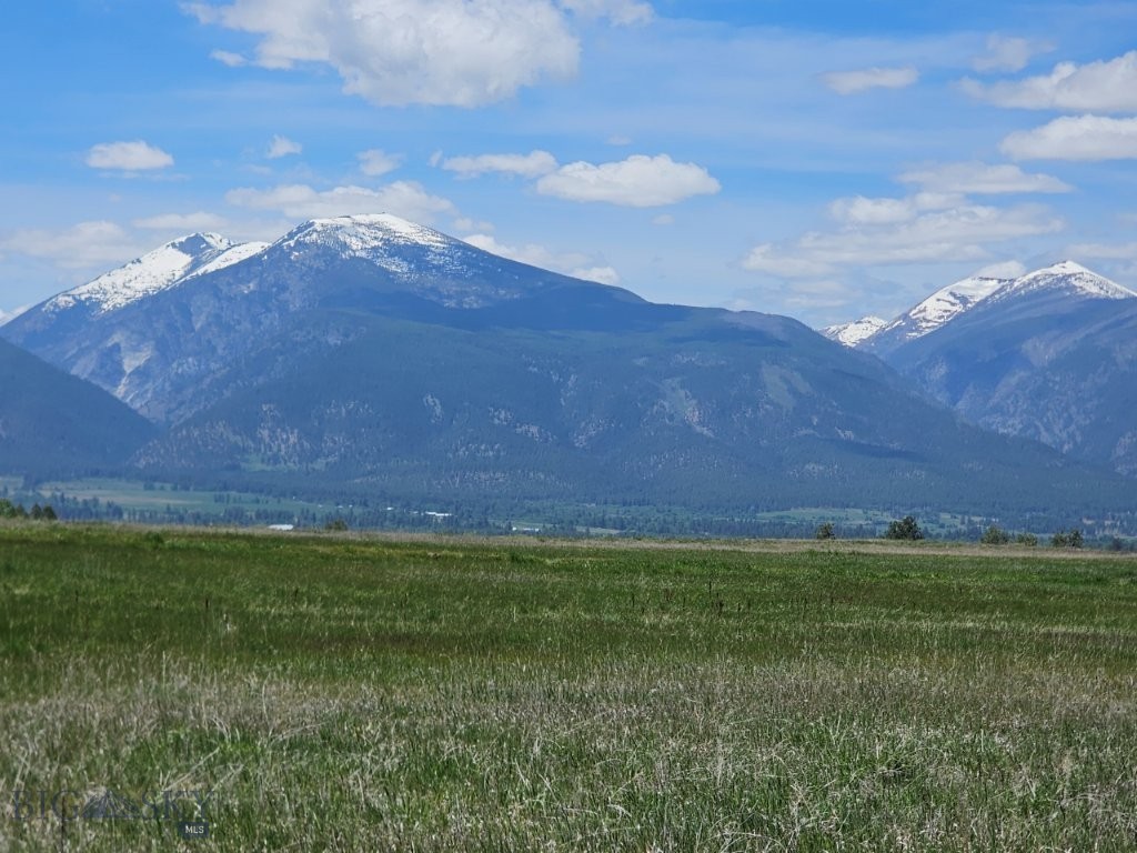 Stunning Bitterroot Mountain views from this 10 Acre property near Stevensville, Montana, with paved road access, electricity, phone, and septic approval. Build your spacious dream home in the beautiful Bitterroot Valley with huge picture windows facing the snowcapped peaks of the Bitterroot Mountains, within minutes of the Bitterroot River and the Lee Metcalf National Wildlife Refuge. The views are absolutely amazing. From the property, you overlook the Bitterroot Valley, and you’re staring straight across the valley at the majestic snowcapped peaks of the Bitterroot Mountains and the Bitterroot Wilderness Area. You’ve got mountain and valley views and can see Montana’s Big Sky Country for miles and miles. Imagine looking out the picture window of your home or cabin every morning at these mountain views. You’ll be able to watch some of Montana’s best sunrises and sunsets right from your porch overlooking the Bitterroot Valley. This 10 Acre property has paved county road access off Illinois Bench Road and then Ambrose Road to the East Side Highway near Stevensville and Florence, Montana. Historic Stevensville is only 7 miles away, and to the north on Highway 93, Missoula, Montana, is only a 25-mile commute. The paved approach off the county road has already been installed. There are very mild covenants to help protect the natural beauty of the area. Electricity and phone are already at the property boundary. And septic has been approved by Ravalli County. So the property is ready to build on any time you desire. Just pick the spot with the views you like the most and build your forever home on your new Montana Bitterroot Valley property. An old apple tree stands on the property, a relic of the old Sunny Side Orchards that once grew here. There’s grass for a few livestock if you’d like to bring your horses as well. The Lee Metcalf National Wildlife Refuge is only a couple of miles away, which has been permanently set aside for open spaces and wildlife to flourish. It's close enough that you can take walks and enjoy all it has to offer, or go fishing right there on the Bitterroot River. The Bitterroot runs the entire length of the valley, and there are numerous fishing access sites so you can take advantage of all the fantastic trout fishing on the river or put in a boat and float for more fishing and scenery on the water. There are hundreds of thousands of acres of the Bitterroot National Forest nearby as well!!