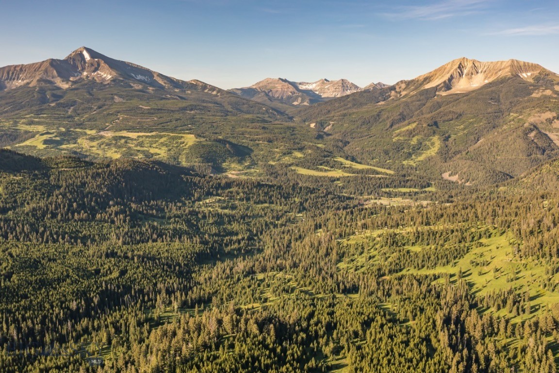 An extraordinary opportunity to claim 276 acres of untamed alpine beauty in the private Moonlight Territories at Moonlight Basin — a rare holding in one of Big Sky, Montana’s most exclusive and conservation-minded enclaves. Tucked behind a gated entrance and bordered by over 2,500 acres of protected wilderness, Moonlight Basin Territory 2 offers sweeping 360-degree views of Lone Mountain, the Spanish Peaks, Fan Mountain, and Cedar Mountain. This is one of the last remaining parcels of its scale — where the majesty of the landscape meets the privilege of proximity.

Here, the terrain unfolds in a stunning tapestry of old-growth evergreens, wildflower meadows, and soaring ridgelines — creating a natural sanctuary that offers both seclusion and inspiration. With multiple homesite options and access to private recreational trails reserved solely for Moonlight owners, Territory 2 is an invitation to design a multi-generational retreat that honors the land while offering every modern luxury.

Just minutes away are the acclaimed slopes of Big Sky Resort and the forthcoming One&Only Moonlight Basin — a five-star alpine resort redefining luxury in the Northern Rockies. Ownership also grants eligibility for membership in the private Moonlight Club, including access to the Jack Nicklaus Signature Golf Course, Ulery’s Lake, world-class dining, wellness facilities, and ski-in/ski-out terrain spanning over 5,800 acres.

As one of the largest privately held properties in Big Sky, Territory 2 is more than a land acquisition — it is a legacy in the making. This is a place to build not only a home, but a family haven, a living memory. A place where mornings begin with alpine light breaking over Lone Mountain, and generations gather beneath wide Montana skies. For those who seek enduring beauty, meaningful privacy, and the rare chance to craft something timeless, Territory 2 offers a singular opportunity to invest in land that lives on — in purpose, in story, and in spirit.