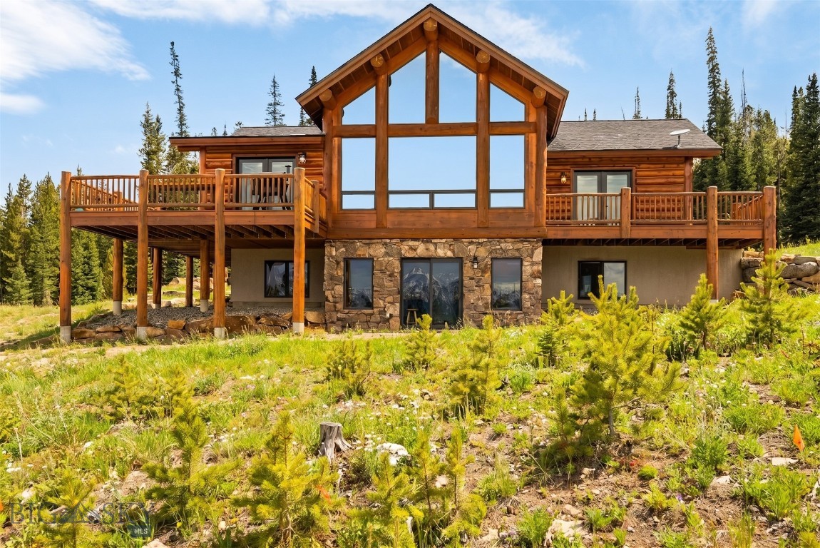 274 Big Buck Road offers a rare combination of privacy, acreage, views, and convenience in Big Sky’s highly desirable Beaver Creek area. Set on 20 acres, this property delivers true Montana living with frequent wildlife sightings, including elk, deer, and bears, all framed by sweeping, jaw-dropping views of the Spanish Peaks, Lone Peak, and the Gallatin Range. Built by Blue Ribbon Builders, the home showcases quality craftsmanship and thoughtful design throughout.
The residence features four bedrooms, four and a half bathrooms, and two separate living areas, providing flexibility for everyday living and hosting guests. The main-floor primary suite offers comfort and convenience, while a massive bedroom located above the garage creates an ideal space for a mother-in-law suite, guest quarters, or additional family accommodations.
The kitchen was renovated within the past two years, adding a modern touch while maintaining a warm mountain aesthetic. Updates include quartz countertops that extend up the backsplash, a wine refrigerator, built-in microwave, induction cooktop, and trash compactor. A wood-burning fireplace with a blower anchors the main living area, efficiently distributing heat and creating a cozy gathering space during Montana winters. A new roof installed this past summer provides added peace of mind and long-term value.
Despite the private and serene setting, the home offers exceptional access to Big Sky amenities. The property is just 10 minutes from blue-ribbon fly fishing on the Gallatin River, 15 minutes to groceries, restaurants, and the hospital, and approximately 25 minutes from world-class skiing at Big Sky Resort. This is a unique opportunity to own acreage, expansive mountain views, and quality construction in one of Big Sky’s most desirable residential settings.