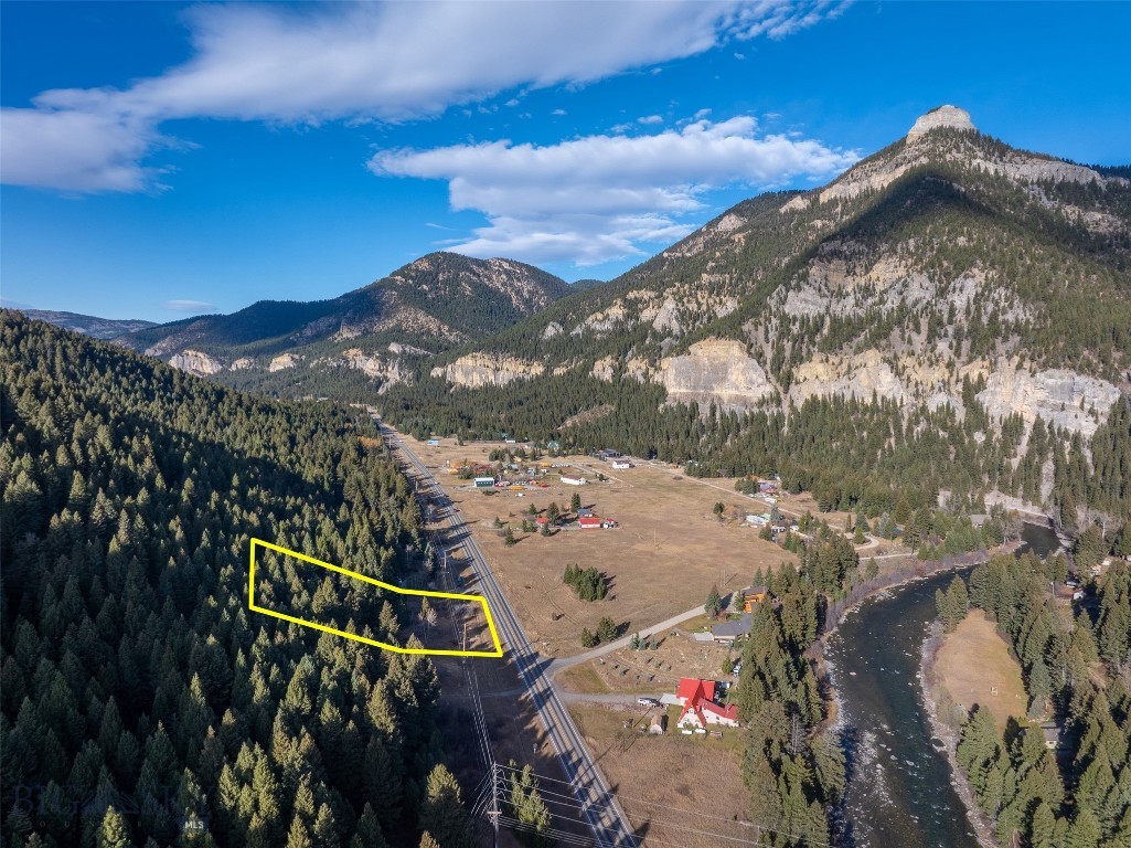 Nestled in the stunning Storm Castle area of Gallatin Canyon, this premier parcel offers a rare chance to own a legacy property in the epicenter of Montana’s outdoor playground. Located minutes from U.S. Forest Service land and multiple trailheads, it provides direct access to thousands of acres of pristine wilderness. The legendary Gallatin River flows directly across the road—world-famous for blue-ribbon fly fishing and exhilarating whitewater rafting. Big Sky Resort, approximately 30 minutes away, consistently ranks among the world’s top ski destinations, delivering unmatched powder and terrain.
A short drive connects you to downtown Bozeman for shopping, dining, and essential services, while Big Sky’s vibrant restaurant and après scene is equally convenient. This exceptional lot is the perfect blank canvas for your custom mountain home or recreational retreat.