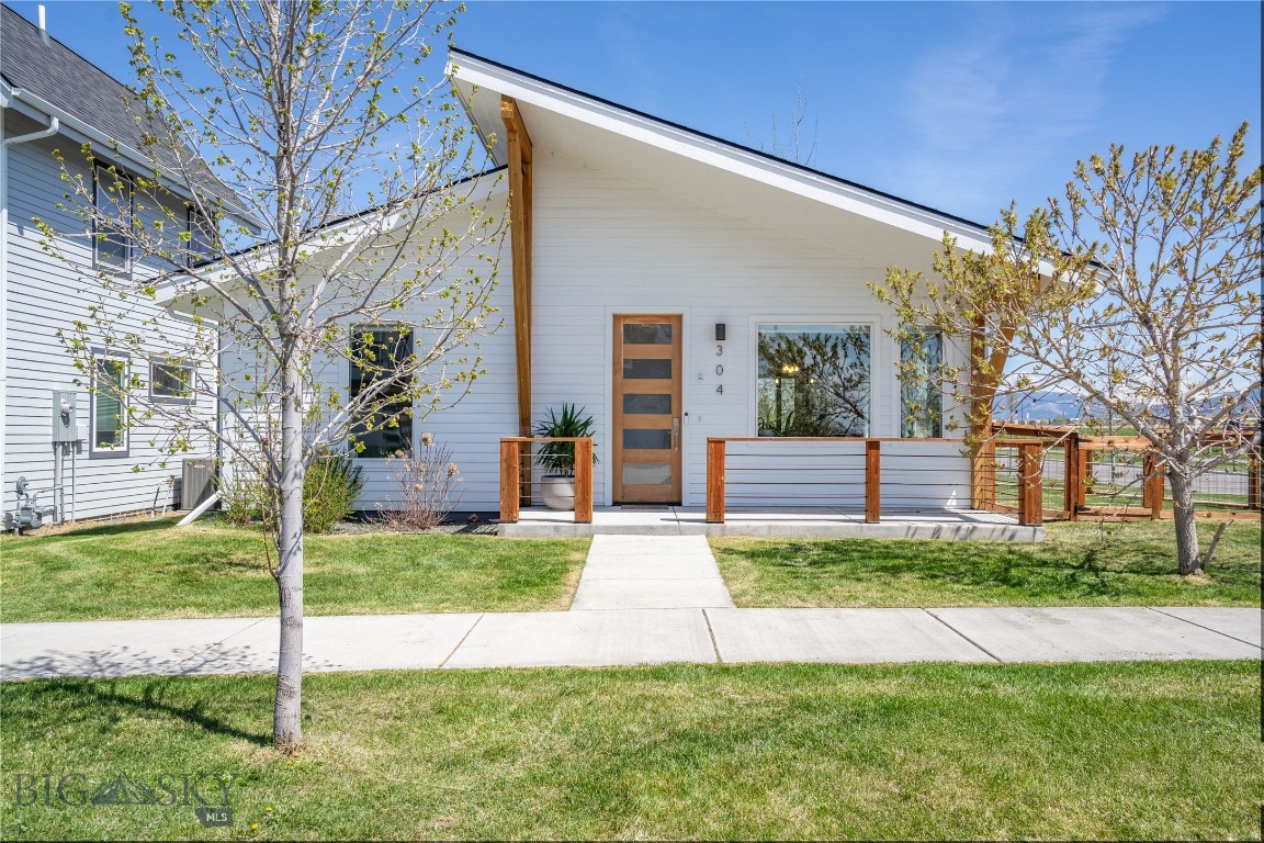A charming modern bungalow in the sought after Lakes at Vally West community! 304 Westgate Avenue offers the rare combination of a two-bedroom single-family home with low-maintenance living, modern finishes, and an inviting neighborhood setting at condominium-level pricing. Positioned on a spacious corner lot with a beautifully landscaped fenced yard, the home provides an exceptional balance of comfort, functionality, and curb appeal. Inside, clean lines, contemporary finishes, and an efficient floor plan create a bright and welcoming atmosphere well suited for everyday living or a convenient lock-and-leave lifestyle. Large windows bring in abundant natural light while the thoughtfully designed interior offers a fresh, modern feel throughout. The manageable size and easy-care outdoor spaces make this property especially appealing for those seeking simplicity and privacy without sacrificing quality or style. A spacious two-car garage provides additional storage and practicality, while nearby parks, trails, ponds, and community amenities contribute to the relaxed lifestyle that has made the Lakes at Valley West one of Bozeman’s most sought-after neighborhoods. Whether you are looking for a full-time residence, a second home, or an efficient and stylish Bozeman retreat, 304 Westgate Avenue presents a unique opportunity to enjoy modern Montana living with ease.