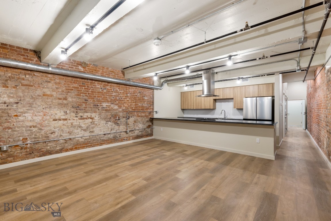 Experience modern living in historic Uptown Butte at Rudolph Condos, Butte's newest condominium development. This 1-bedroom, 1-bathroom condo features an open floor plan and exposed brick. The stylish kitchen boasts stainless steel appliances, while the spacious living area is perfect for entertaining. Located in the heart of Uptown Butte, you’ll enjoy easy access to dining, shopping, and local attractions. Don’t miss this rare opportunity to own a contemporary condo in a vibrant, historic setting! 1 bedroom are non-conforming