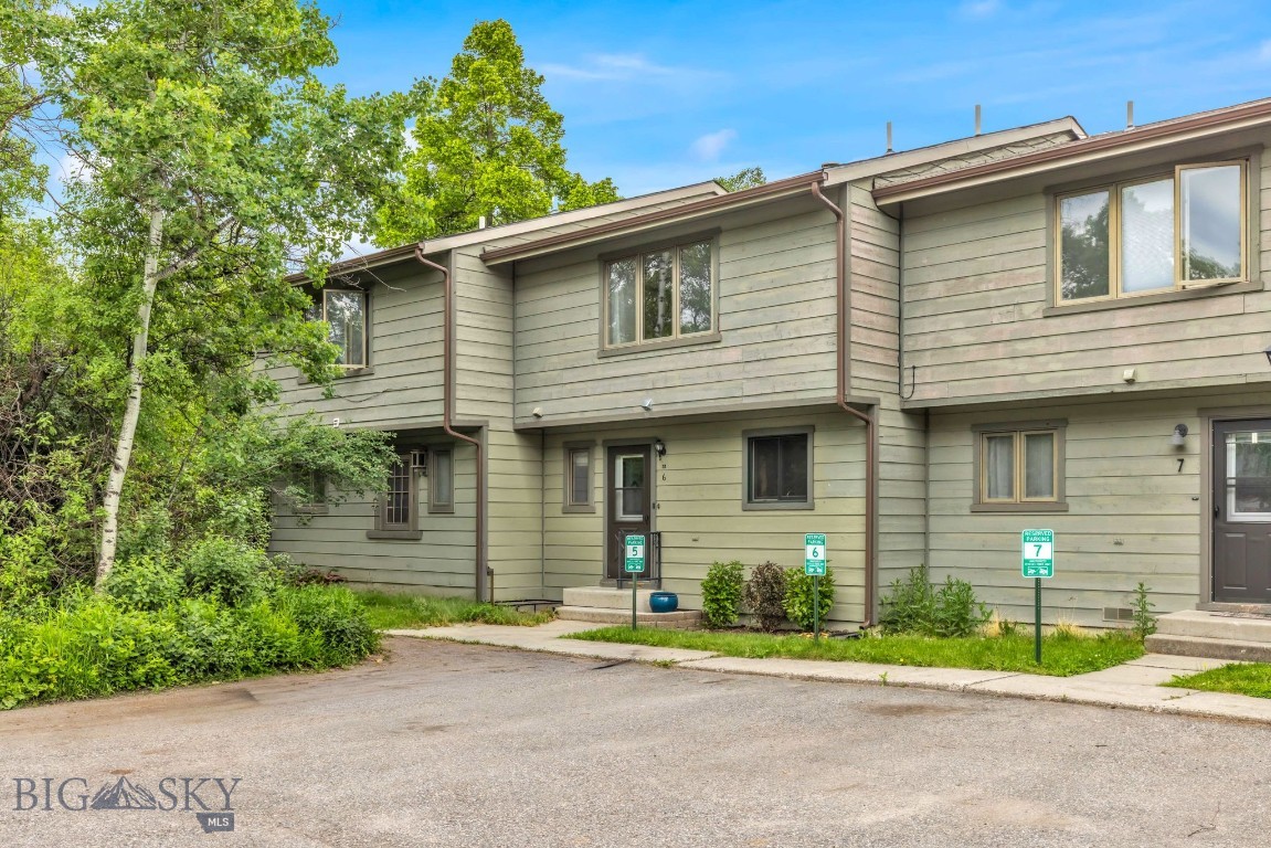 Private south Bozeman Tanglewood condo with a rare and highly functional upper-level layout featuring two bathrooms upstairs, including an ensuite bath for the primary bedroom. This 3-bedroom, 2.5 bathroom condo offers a warm main level with an updated kitchen, dining area, and a spacious sunken living room with exposed beams, brick fireplace, built-ins, and large glass doors leading to the rear deck. The fenced backyard backs to a wooded area, creating a quiet and private outdoor setting that is hard to find this close to town. Recently updated kitchen, bathrooms, and air conditioning. Both the boiler and A/C units have recently been serviced. Enjoy dedicated parking, 1-car garage/storage, and close proximity to MSU, trails, downtown Bozeman, shopping, and restaurants. A well-located condo with privacy, character, and a floor plan that sets it apart from others in the complex. No renting for less than 30 days.