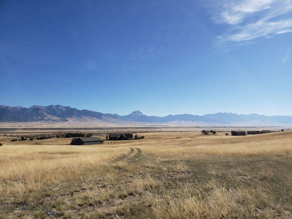 Enjoy exceptional panoramic views of the Madison Range and the valley from this gently sloping lot in the Shining Mountains neighborhood. This 5.12-acre lot is ready to build your dream home on. Power and high-speed fiber optic internet are already available at the lot, making it ideal for modern living in a peaceful mountain setting. A well is already in place at 444 feet deep with 1 GPM output; a cistern can be added for additional water storage if desired. 
This property is located just minutes from fishing access on the Madison River, making outdoor recreation right at your doorstep.
Owners have access to trout-stocked Haypress Lake, BLM, and forest service lands. The property comes with light covenants to protect your investment without restricting your vision. 
This property is ready and waiting for your custom Montana retreat—bring your vision and make it a reality.