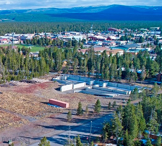 2 Acre lot with high density potential in a low density neighborhood! The East lot boundary is shared with Forest Service land.  Existing structure is a partially developed, subterranean parking garage designed to service 2 of 4 buildings.