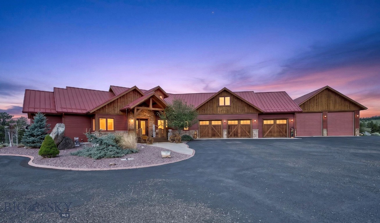 Discover refined Montana living close to Helena and minutes from Canyon Ferry Lake. This custom-built luxury home offers privacy, beautiful curb appeal, and high-end finishes throughout. The chef’s kitchen features a high-end range, large pantry, functional island, and open-concept layout flowing into the dining and living areas with vaulted cathedral ceilings and hardwood flooring—ideal for entertaining and everyday living. The main level includes a spacious primary suite, laundry room, and dedicated office. Step outside to a newer deck with built-in BBQ, perfect for hosting and enjoying Montana’s big sky views, plus a firepit overlooking the landscape. Upstairs offers three bedrooms, two bathrooms, and an additional living area. The fully finished basement includes a bedroom, full bath, second living space, and room for a home gym, creating flexibility for multi-generational living or guests. The oversized three-car garage includes cabinetry, storage, and floor grates for managing snow and mud. A breezeway leads to an extra-large shop with upper-level storage and ample space for vehicles, equipment, and recreational toys. Additional amenities include a lap pool, sauna, and generator. With expansive square footage, multiple living areas, and premium features, this Helena property is ideal for buyers seeking Montana luxury real estate, a private retreat, or a large home with space, comfort, and convenience.