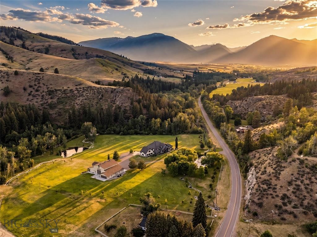 The 270 Ranch at Skalkaho Creek represents a rare opportunity to own one of the Bitterroot Valley's premier recreational and sporting properties. Located within Montana Hunting District 270, the property sits in one of the state's most coveted hunting regions. Renowned for its strong elk populations, quality mule deer habitat, and vast expanses of public land, District 270 consistently attracts serious sportsmen seeking exceptional hunting opportunities. Encompassing 652+ acres and bordering thousands of acres of Forest Service land, the ranch offers unmatched access to some of Western Montana's finest hunting, fishing, and outdoor recreation. More than half a mile of Skalkaho Creek flows directly through the property, creating an exceptional private fishery and providing some of the most sought after fly fishing opportunities in the region. The ranch serves as an ideal base camp for exploring the renowned fisheries, mountain lakes, and streams that make the Bitterroot Valley a destination for sportsmen from around the world. The combination of creek frontage, irrigated meadows, timbered hillsides, and adjacent public land creates exceptional wildlife habitat rarely found in a single offering. At the heart of the ranch sits an approximately 14,000 sq ft executive residence thoughtfully designed for entertaining, retreats, and large gatherings. Featuring eight ensuite bedrooms, eleven bathrooms, a home theater, sauna, hot tub, smart home integration system, and high speed fiber internet, the residence balances luxury living with the rugged beauty of its surroundings. Additional improvements include a fully outfitted event barn with guest accommodations and commercial grade amenities, two rustic cabins, a historic 1915 farmhouse, a large riding arena complete with multiple stables, and a spacious shop providing ample storage for equipment and vehicles. Agricultural operations currently support hay production, pigs, and chickens, providing valuable agricultural tax benefits while maintaining the property's productive character. Whether envisioned as a sporting retreat, legacy ranch, corporate getaway, or private sanctuary, the 270 Ranch delivers an extraordinary combination of water, wildlife, luxury, and direct access to the vast public lands of the Bitterroot Valley.