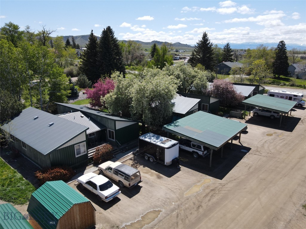 Seize this rare investment opportunity in the heart of Sheridan, Montana! This income-generating property features three separate duplexes, offering a total of six rental units in the scenic Ruby Valley. Perfect for investors seeking steady cash flow or owner-occupants looking to offset costs, this property combines small-town charm with strong rental history/potential. Each unit features 2 bedrooms, 1 bathroom, living room, kitchen, and laundry room and is equipped with essential appliances - including a range, refrigerator, and washer/dryer. All 6 units have their own entry with private deck. This prime location is right on the corner of Mill St and Kearny. Don’t miss this chance to own a turnkey income property in one of Montana’s most charming communities!