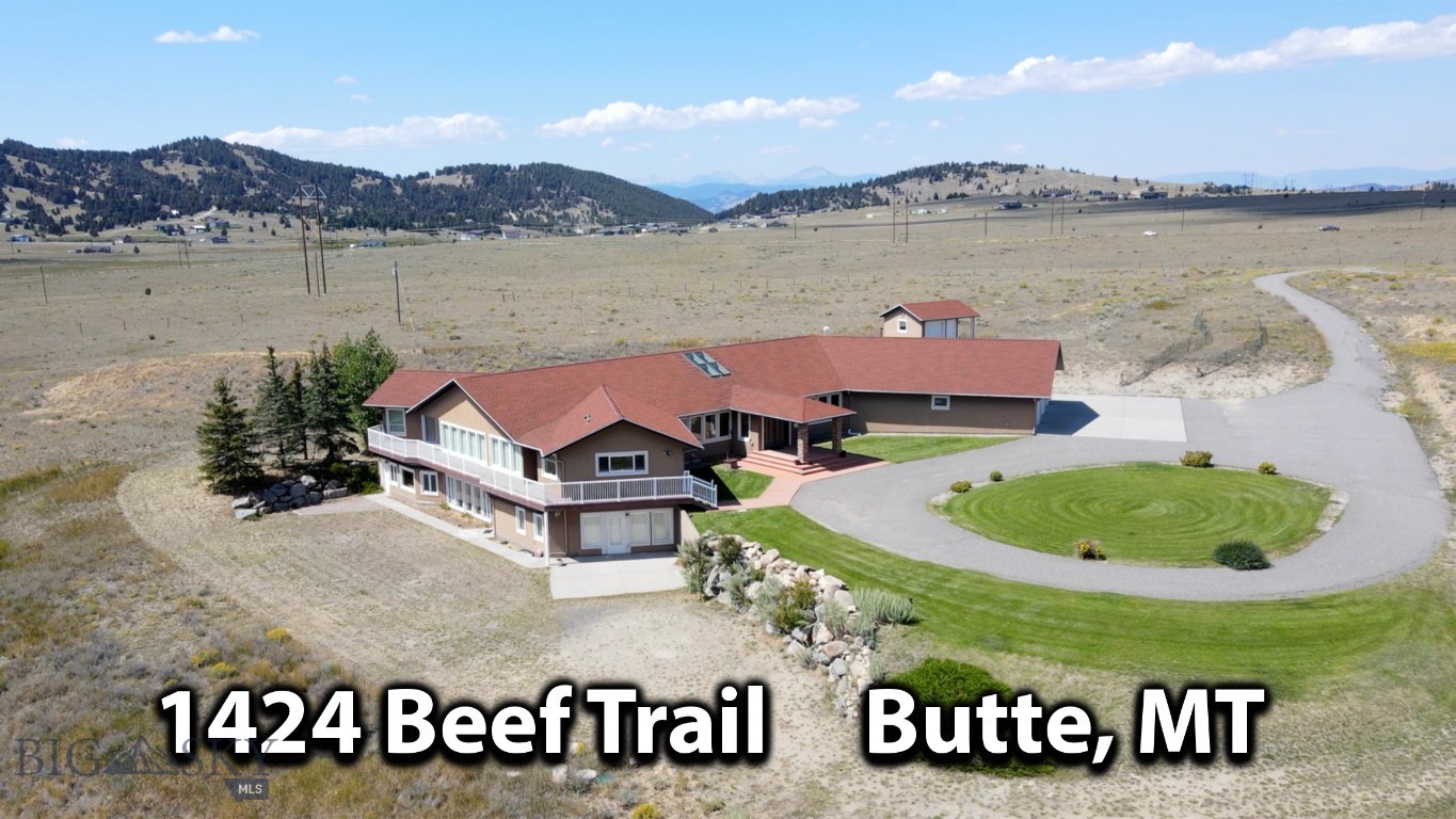 Presenting a Montana masterpiece that is tucked away on 65 acres and is surrounded by The Rocky Mountains.  It offers a perfect mix of having "plenty of elbow room" but still being only minutes to town (Butte) on maintained roads.  As you approach this unique property, a sense of anticipation fills the air knowing you are about to enter a realm of enchantment—a place where privacy reigns supreme and breathtaking vistas unfold before your eyes.  A grand foyer welcomes you into a luxurious and elegant house with architectural features and ornamentation that make this estate extra-special. Step into any room and you will be greeted by spectacular panoramic views of the majestic mountain ranges.  The heart of the home holds a walk-in atrium that exudes soothing energy tranquility.  Multiple primary suites, each with its own walk-in closet, provide comfort and privacy.  The basement is a walk-out and an elevator is available to get you from floor to floor. The wrap around deck allows a seamless transition from the indoor to outdoor the spaces.  3-car attached garage.  For those who cherish the equestrian lifestyle, a charming horse barn and corral await.   Southwest Montana is rich in recreation, wildlife and scenery and this magnificent property was built for comfort, privacy, and total enjoyment of life!