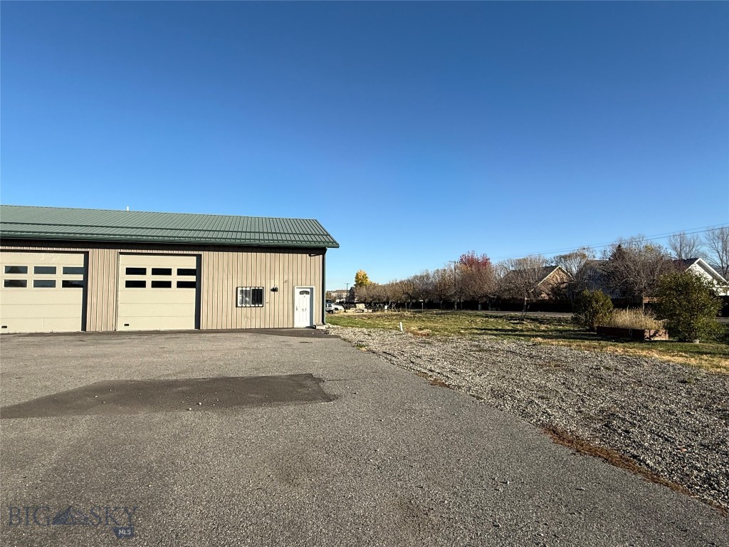 Discover a fantastic opportunity in a great Belgrade location! This spacious 2,500 sq. ft. warehouse offers a highly functional layout ideal for a variety of uses. The main shop area features two 12’x12’ overhead doors, in-floor drains, and high ceilings, providing excellent versatility for storage, workshop, or business operations. An additional 1,000 sq. ft. of lofted storage adds valuable extra space for equipment, inventory, or office conversion. With its convenient access, adaptable layout, and solid construction, this property is a rare find for anyone seeking a practical and well-located warehouse in the Gallatin Valley.