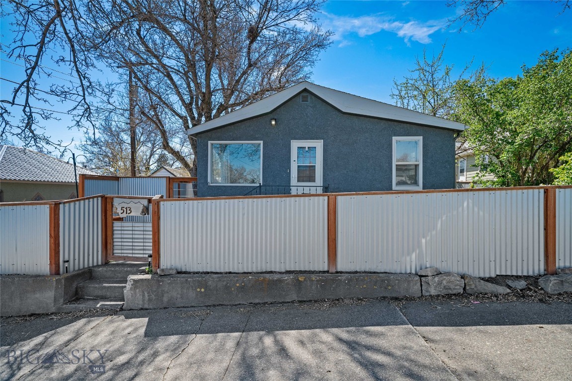 Sweet northside bungalow tucked on a quiet street just minutes from downtown Livingston. This 2-bedroom home (one non-conforming) features a bright, welcoming living room and a spacious main-floor kitchen designed for easy, everyday living.

The lower level adds flexibility with a remodeled bathroom and bonus living space—ideal for a media room, guest area, or additional bedroom.

Outside, enjoy a fully fenced, private backyard with mature trees and established landscaping. A gazebo creates the perfect setting for Montana evenings under the stars, and a large chicken coop adds a practical homestead touch.

Complete with a detached 2-car garage and located less than a mile from downtown, this property offers comfort, versatility, and convenience.