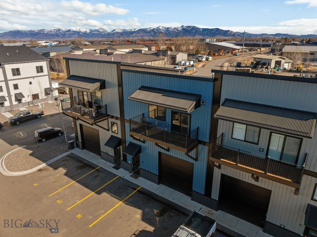Fully furnished and lightly lived in, this versatile Live/Work unit presents an exceptional opportunity in the heart of Four Corners. Successfully operated as a high-performing short-term rental, the property is truly turnkey for an investor or ideal as a primary residence with income flexibility, as covenants allow for short-term rentals and a variety of business uses.

Designed with both comfort and functionality in mind, the space features granite countertops, stainless steel appliances, air conditioned, luxury vinyl plank flooring, and a third-floor covered balcony. The heated garage/shop includes a 12’ x 12’ roll-up door and is equipped with 220-volt power, making it well-suited for workshop needs, recreational gear storage, or electric vehicle charging capability.

Conveniently located with easy access to Bozeman, Belgrade, and Big Sky, this property offers efficient airport-to-Big Sky connectivity — an ideal position for both full-time living and investment use in the Gallatin Valley.

A rare opportunity to own a furnished, income-producing property in a flexible and highly desirable location.