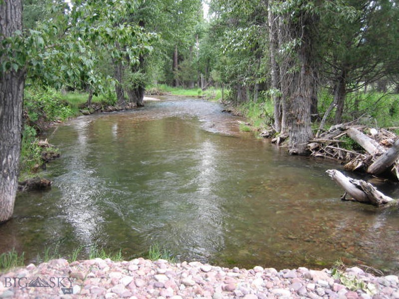 Bob Marshall Wilderness Tap House & Grill- If you have dreamed of creating your own tap house in the recreation destination of Seeley Lake, this is it! This nearly level 20 acres of vacant land fronting on the scenic fishery of Morrell Creek is located on Highway 83 right on the southern entry in to Seeley Lake. Property is already served by Seeley Lake Water District & electric & fiber are installed. Ground water monitoring has been complete & permitted for the max of 5,000 gpd. This should allow a tap house/ grill & 3 creek front rental cabins or a large hotel. Additional non-consumptive ponding potential exists by using existing water rights to an irrigation canal flowing by the proposed tap house location. The Bob Marshall Music Festival has been held here. Broker owned