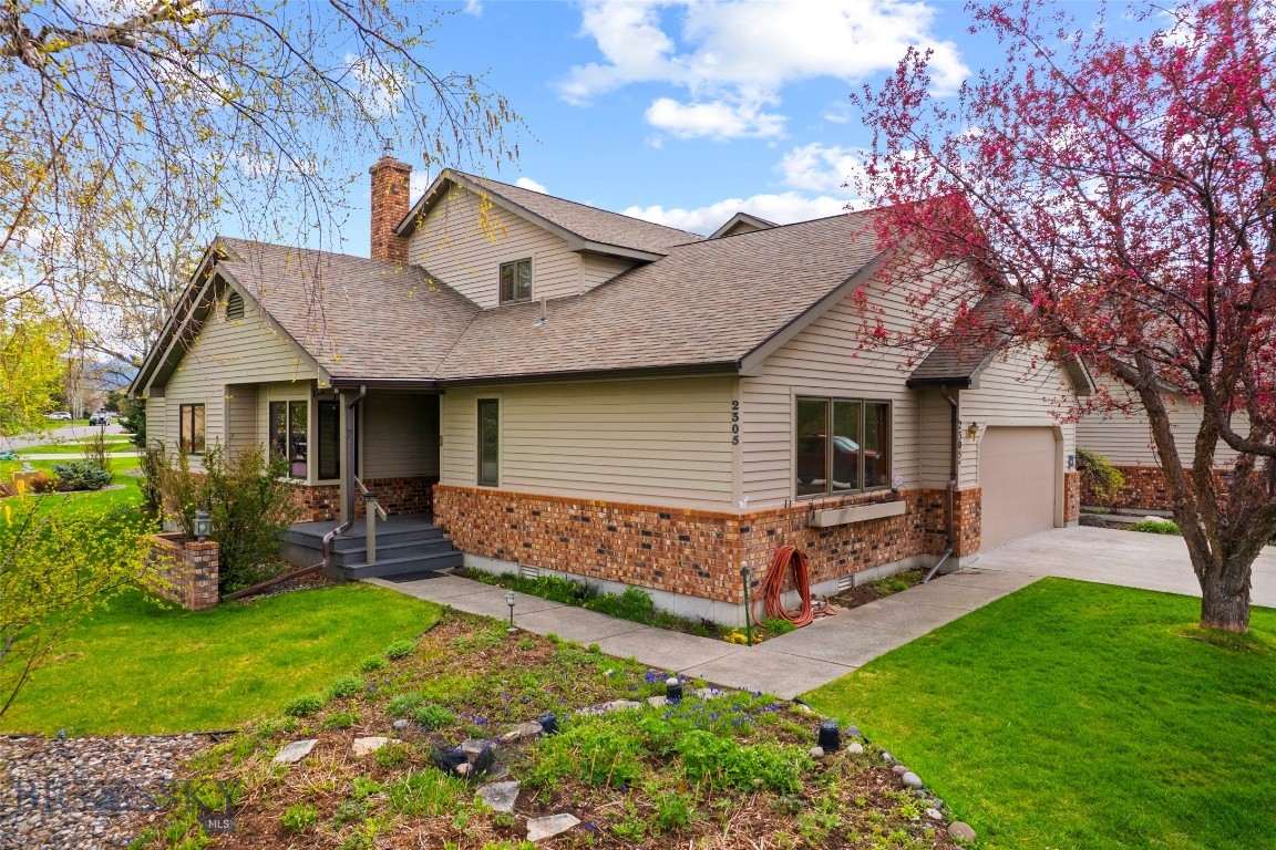 2305 Fairway Dr presents a well-designed end-unit condo offering 3 bedrooms, 3 bathrooms, and 2,577± square feet in the highly desirable Valley View golf course setting. With an attached 2-car garage and a thoughtful layout, the home balances comfort, functionality, and style. The main level is defined by soaring ceilings in both the living room and primary suite, creating a bright, open atmosphere. A gas fireplace adds warmth to the living space, which flows seamlessly into a sunroom and a designated dining area. The kitchen features a breakfast nook and enjoys unobstructed views of the open green space just beyond the condo. The primary suite serves as a private retreat with a spacious ensuite bath complete with a soaking tub, walk-in shower, heat lamp, and walk-in closet, along with direct access to the hot tub deck. A second bedroom and ¾ bath on the main level provide convenience and flexibility. Upstairs, a large third bedroom, ¾-bath, and a lofted area overlooking the living room create additional living space, complemented by an oversized storage room or potential private office. Outside, you'll find mature landscaping around the south-facing deck equipped with a hot tub. Solar panels help keep the summer electric rates nearly free! Ideally located with proximity to all that Bozeman has to offer, this condo combines lock-and-leave living in a beautiful environment.