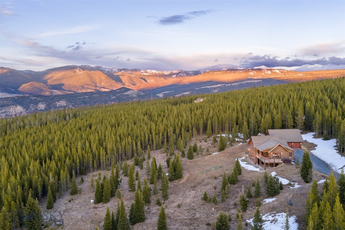 Welcome to 165 Trophy Bull Road—an immaculately maintained mountain retreat set on 20 pristine acres in the heart of Big Sky Country. This beautifully cared-for 3-bedroom, 3.5-bath home, plus a versatile bonus room, offers the perfect blend of comfort, space, and Montana lifestyle—an ideal basecamp for year-round adventure.  The land is what truly sets this property apart. Gently rolling, usable acreage like this is exceptionally rare in the Rocky Mountains—especially at this price point and this close to Yellowstone National Park.  Conveniently located just 15 minutes from Big Sky Town Center and approximately 25 minutes to Big Sky Resort, you’ll enjoy quick access to world-class skiing, dining, shopping, and year-round outdoor recreation—while still savoring the peace and privacy of your own expansive acreage.