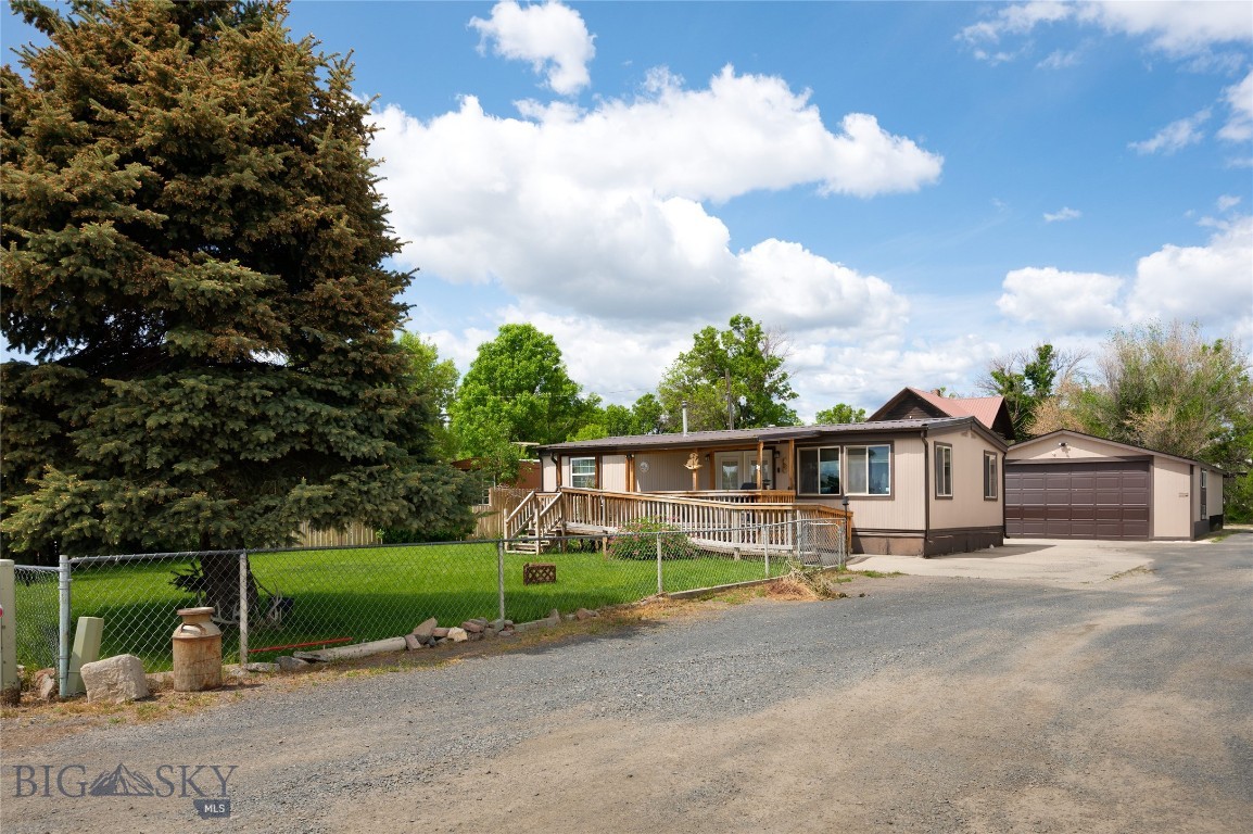 This is an incredible opportunity to own your own home in the quaint community of Whitehall, MT.  Handicap accessible throughout and easy one level living.  One large bedroom with abundant natural light with an extra sitting area.  Sheetrock walls throughout, laminate flooring, pellet stove, and roll in shower.  The kitchen features tile floor, countertops and updated cabinets with some pullouts. A bonus room, which could be an additional bedroom, has several windows making it bright and cheery.  A covered deck in the front yard with wheel chair ramp. In addition there is a 20x25, detached 2 car garage with overhead door opener.  The yard is fully fenced and landscaped with underground sprinkler system and well established perennials.  Boarders an open field to east and privacy on a dead end street.  New school and the local pool right down the road.  Easy commute to Bozeman or Butte. Note Audio and Video security system in place.