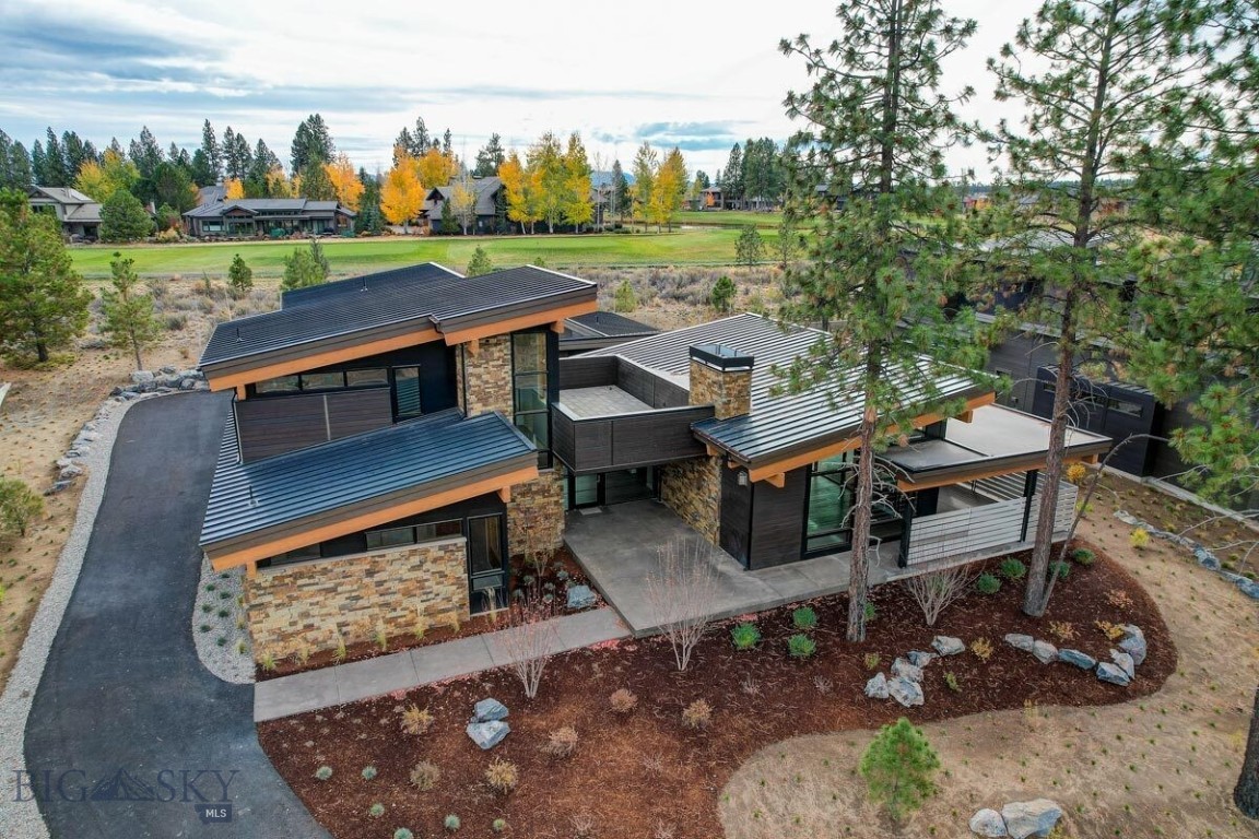 The first custom build in Bozeman's newest luxury community, River Road Estates! Soak up the incredible 360° views and serenity of the mature trees. A local, renowned builder is ready to break ground on this beautiful 3.71 acre lot, a rarity in today's building environment. This mountain modern retreat enjoys an open and functional floor plan, chef's kitchen, private courtyard, and roof top deck. The main floor master enjoys a luxurious en suite bathroom and huge walk-in closet. You will find two more en suite bedrooms on the main level, as well as a large laundry/mudroom and spacious 3-car garage. The upper level boasts a game/bonus room, a fourth bedroom and bathroom, as well as a perfectly-positioned rooftop deck to soak up the surrounding riparian landscape and mountain views. The current plan has the ability to add a basement and customization options are available, allowing you to make this your ultimate Montana dream home.