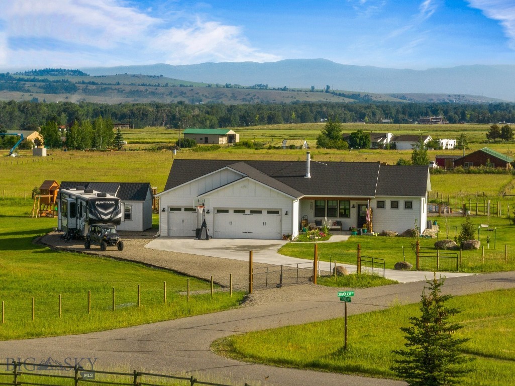 Welcome HOME to 37 Cinnamon Bear Court. Nestled on 2.14± fenced acres in sought-after Bear Creek Properties subdivision, this 5-bedroom, 4-bathroom home offers 4,252± square feet of thoughtfully designed living space with breathtaking Spanish Peaks & Bridger Mountain views. Ideally situated between Bozeman & Big Sky, this property delivers the perfect balance of convenience & recreation.
This home simply welcomes you in with an open-concept living, dining, and kitchen area designed for both everyday living & entertaining. The modern farmhouse kitchen features quartz countertops, stainless appliances, a generous center island, & panoramic views from the kitchen sink. A floor-to-ceiling rock fireplace w/ reclaimed wood mantel anchors the living room, while custom barn doors & procured finishes add warmth & character.
The main-level primary suite offers a quiet retreat complete with clawfoot soaking tub, tiled walk-in shower, dual vanities, & oversized walk-in closet. Two additional guest rooms & full bath complete the main floor. Downstairs, you'll find exceptional flexibility with a large media room, fitness area, office, kitchenette, 2 addt'l guest rooms w/ walk-in closets, & 2 addt'l baths. The home equipped with AC for comfort, has a new 14' swim spa, & exterior surround LED soffit lighting. 
Outside, the property is equally impressive. You'll enjoy a greenhouse, designated/fenced garden area, drip irrigation system, RV parking with 50-amp service, & a four-car garage with room for vehicles, recreational equipment, & Montana toys. The ability to rent the home & 4-H animals are allowed under light covenants, offering flexibility rarely found this close to town.
Located less than 3 miles from Gallatin Gateway, you'll enjoy Stacey's Old Faithful Bar & Steakhouse, The Westerner, & the Gallatin River only moments away, offering world-class fly fishing & endless recreational opportunities. Outdoor enthusiasts will appreciate nearby Little Bear National Forest Access, hundreds of acres of State Land, the Axtell-Anceny area, Turner's Flying D Ranch conservation lands, & Wilderness for hiking, horseback riding, hunting, wildlife viewing, & year-round adventure.
Conveniently located just 15 miles to Bozeman, 17 miles to Bozeman Yellowstone International Airport, & 27 miles to Big Sky Resort. Properties offering this combination of acreage, mountain views, local hiking & recreation, close proximity to both Bozeman & Big Sky are increasingly difficult to find.