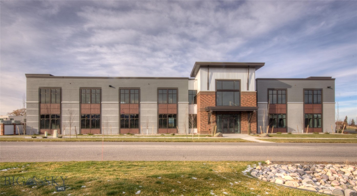 161 Enterprise Boulevard is a premier Class A office opportunity in Bozeman, Montana, offered for lease or for sale. Originally developed for Oracle America, Inc., the building totals approximately 21,207 square feet on 1.63 acres and reflects a high standard of design, flexibility, and functionality. Configured as four distinct suites, the property offers leasing options for tenants seeking the full building, a single suite, or any combination of units to suit their operational needs. The building provides 88 common parking stalls, ensuring ample capacity for employees and clients alike, and is surrounded by a strong base of technology firms, research groups, and professional services. With modern infrastructure, attractive landscaping, and corporate-grade construction, 161 Enterprise Boulevard is designed to accommodate a wide range of office users seeking both sophistication and practicality in their workplace. Existing furniture may be negotiated, and the space includes conference room AV, kitchenette equipment, phone booths, cabling and IT infrastructure, and access control and security systems. As one of the fastest-growing small cities in the country, Bozeman continues to attract investment, talent, and innovation. The city’s combination of an affluent population, access to a highly educated workforce, and its reputation for quality of life make 161 Enterprise Boulevard an exceptional leasing opportunity in a market defined by sustained growth and demand.