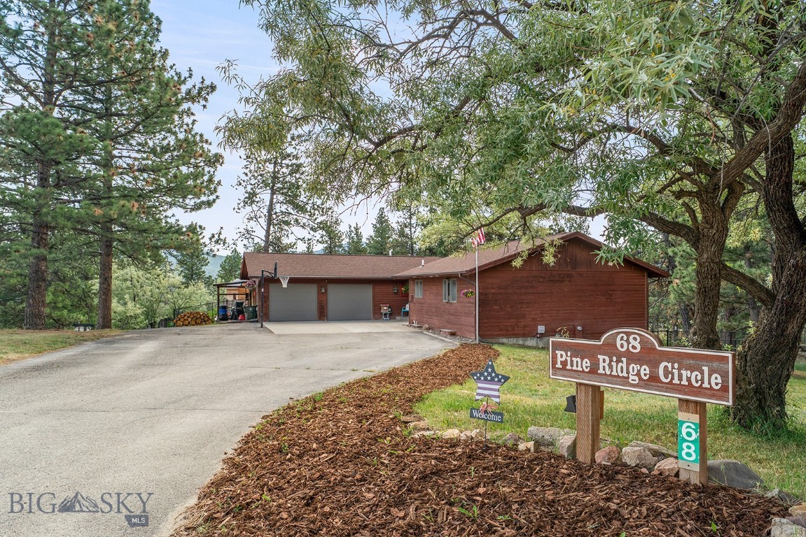 Quintessential Montana lifestyle is waiting for you at 68 Pine Ridge Circle in Clancy. This 4 bedroom, 3 bathroom residence, offers a harmonious blend of comfort and outdoor living. Set on a private, 1.57 acre wooded lot, the yard is a canvas for outdoor enjoyment. Gather around the fire pit on cool evenings, host memorable meals on the large low-maintenance deck, or enjoy the sunshine while growing your garden in the raised beds. The interior of the home gives a welcoming feel when you walk in the door. The updated kitchen has gorgeous granite countertops and stainless steel appliances. There is a rock fireplace in the living room to gather around on cold winter evenings. Plenty of storage throughout the home but the oversized two-car garage provides additional storage. This property presents an unparalleled opportunity to embrace spacious living and outdoor enjoyment in Clancy.