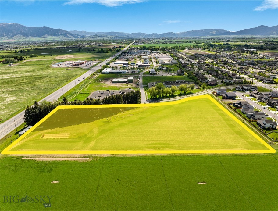 Excellent development land with Huffine frontage.  This 8 acre parcel is County zoned M-1 to allow for a multitude of uses.  Lot is in the growing Woodland Park subdivision, and sits on the corner of Red Mountain Drive and Huffine for premier visibility.  There is a farmhouse, detached garage and shed on the property that convey with the sale.  There is an access easement for Haley Springs Road through the property that will create more localized visibility in addition to the heavy visibility on Huffine.
