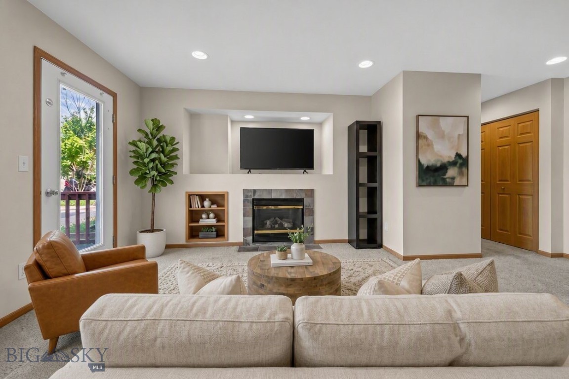 Private entrance, personal patio, and an end-unit setting—this home delivers a refreshing alternative to traditional condo living, where privacy and outdoor enjoyment are built into everyday life.
Inside, the open-concept living area is designed for both comfort and entertaining, featuring a cozy fireplace, built-in shelving, and a breakfast bar that anchors the kitchen and living spaces. The functional floor plan includes a powder room off the main living area, along with two well-sized bedrooms and a full bathroom.
Adding to the appeal, a private one-car garage is conveniently located just across from the unit, offering secure parking and practical storage for outdoor equipment and seasonal gear.
The location is hard to beat. Situated across from Bozeman Pond, you’ll enjoy immediate access to trails, open space, and recreation while remaining just minutes from the MSU campus, downtown Bozeman, restaurants, and shopping. It’s an ideal blend of accessibility, privacy, and everyday ease.
Please note that this unit must be owner-occupied due to current HOA rental ratios. The interior was freshly painted with the exception of the turquoise bedroom, and some photos have been virtually staged to demonstrate the home's full potential.