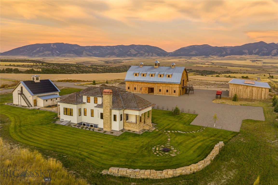 The SxS Ranch Estate encompasses 161± deeded acres northwest of Bozeman, Montana, with breathtaking views of the Tobacco Root, Bridger, Gallatin, and Madison Mountain ranges. This property is in the private SxS Ranch Reserve and includes a shared recreational interest in 971± total acres. About 1.4 miles of Dry Creek meanders through the east side of the private reserve, providing shared access to exceptional trout-filled water. Much of the property is dedicated to wildlife habitat for pheasants, sharp-tailed grouse, Hungarian partridge, whitetail deer, mule deer, and elk. The SxS Ranch Reserve offers parcels ranging from 68± to 188± acres, each with a thoughtfully placed homesite, creating a landscape of wide-open spaces and breathtaking vistas.  Designed by Faure Halvorsen Architects, the four-bedroom, four-bathroom home features traditional architecture, modern technology, and high-end finishes. The centerpiece of the property is the strikingly finished iconic Western barn, while a large equipment shed allows for extra storage. A five-acre building envelope provides opportunities for constructing, discretely sited, another residence. The SxS Ranch Estate will resonate deeply with the discerning buyer(s) who has/have an appreciation for the historical context of the Rocky Mountain West. This is an opportunity to truly own the Last of the Best.