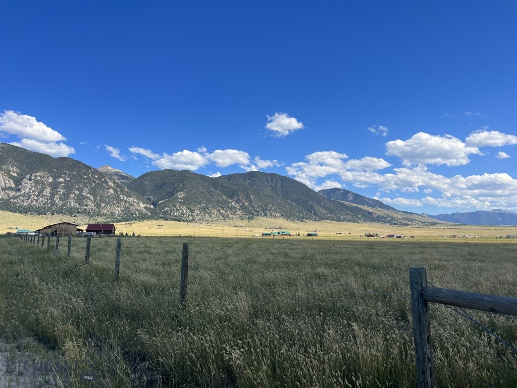 Terrific 6.368 acre perimeter lot - bordering the runway at Big Sky/Ennis Airport (KEKS) to the west and large ranch holding to the north. Lot 29A is designated 'Airport Commercial' permitting hangars, operation of aircraft-related commercial services, and/or residential use. This is an excellent building lot, located at the end of the road, with private subdivision access to US Forest Service land and Lee Metcalf Wilderness area for endless recreation. Fantastic Madison Valley views and close driving proximity to the Madison River. Only 30 miles to Big Sky Ski Resort with a road pass for Jack Creek Road. This offering is fully fenced and power is available. The Airport underwent extensive renovation recently, extending the runway to 7,600'. There is a gate designed for small aircraft bordering the unimproved grass taxiway. Buyer’s responsibility to contact Madison County commissioners or airport board to discuss access to the unimproved taxiway.