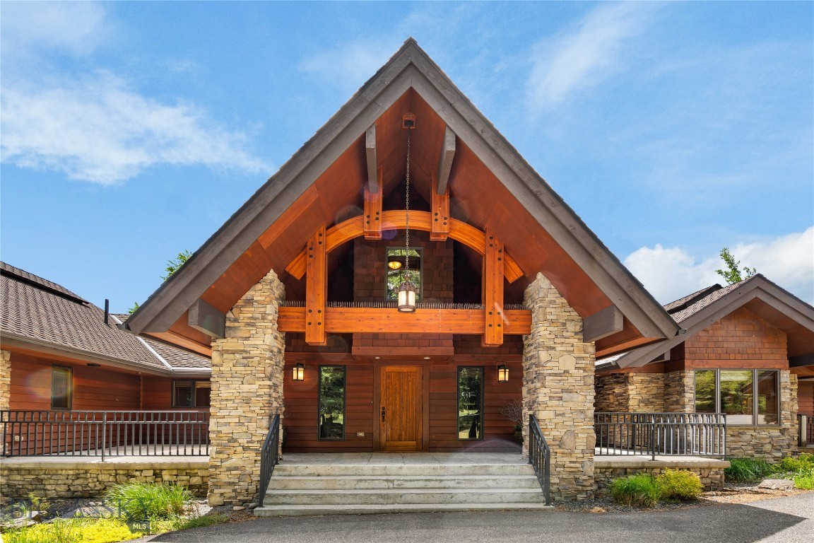 Stately Big Sky Mountain Retreat with Lone Mountain Views:  
Experience the best of resort mountain living in this stately 6,031 square foot residence set on 1.92 acres in the highly sought after community of Big Sky.  Perfectly positioned to capture spectacular Lone Mountain views, the home enjoys a rare setting backed to the west by approximately 40 acres of greenbelt, creating a sense of privacy and scale that feels far larger than the deeded acreage.  Offering both mountain serenity and exceptional convenience, the property is minutes from Mountain Village and skiing, Meadow Village and Town Center, with year-round recreation, dining, shopping, and resort amenities close at hand. Buyers also have the exclusive opportunity to purchase adjoining lots to the north and south, offering a rare path to expand the estate setting in one of Big Sky’s most desirable neighborhoods.  Traditional mountain design meets enduring craftsmanship throughout this never-rented multi-level residence, with one level living.  It is impeccably maintained including annual interior and exterior staining and painting. Extensive additions and thoughtful remodels completed in 2015 and 2016 enhanced the original home, while a new roof installed in 2020 adds lasting peace of mind. Substantial wood beam accents, entry columns, and two dramatic stone fireplaces create a warm, refined alpine presence inside and out.  The heart of the home is a grand kitchen designed for gathering, featuring granite countertops with live edges, a large island, a wood breakfast bar, and a wine room. Expansive living areas are anchored by gas fireplaces in the living room, family room, and primary bedroom, while air conditioning adds comfort across the seasons. A two-car attached garage, detached structure with a third parking space, and abundant storage provide the practicality expected in a true mountain retreat. Large decks invite outdoor enjoyment in every season, from quiet mornings overlooking Lone Mountain to evenings framed by crisp mountain air and open sky. The convenient circular driveway offers an elegant arrival experience, while the home’s position against greenbelt land enhances the feeling of seclusion without sacrificing access to Big Sky’s premier amenities.  This is a rare opportunity to own a substantial, beautifully maintained Big Sky residence in a spectacular resort setting where privacy, views, craftsmanship, and convenience come together in one exceptional mountain property.