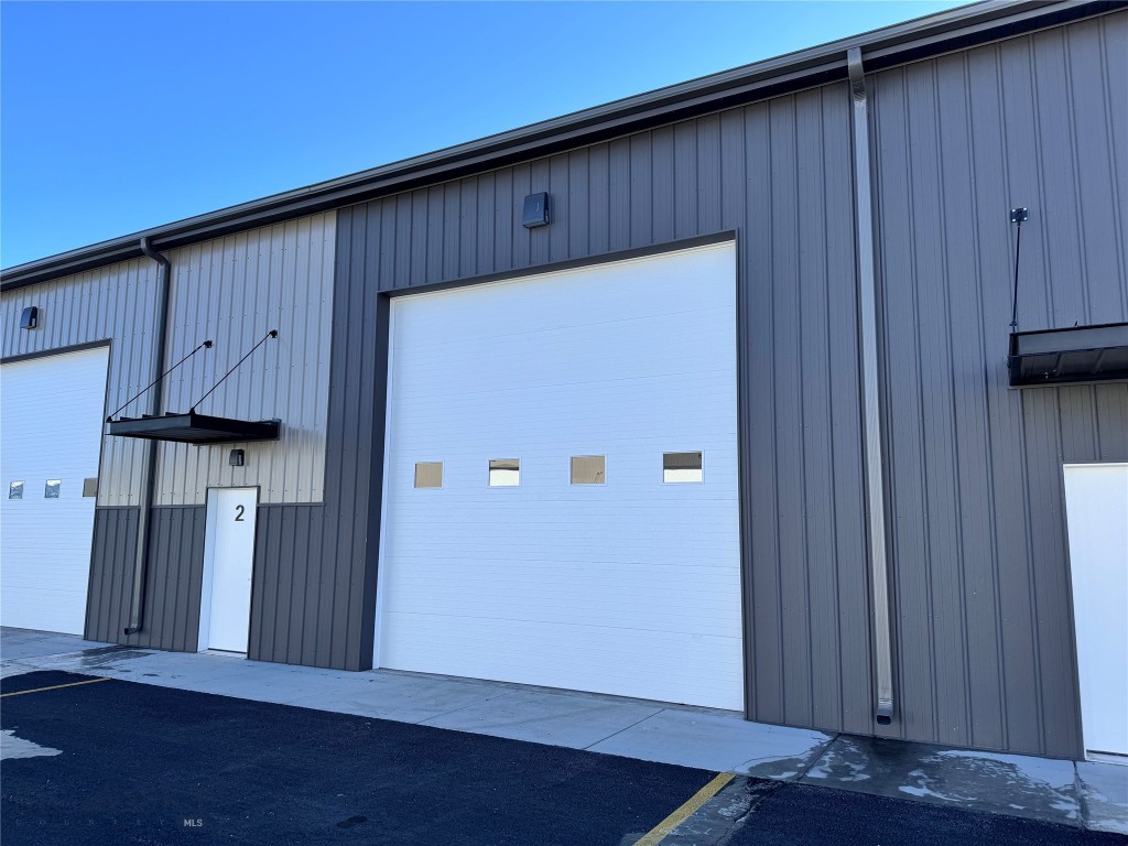 Strategically located commercial warehouse in North Belgrade, just a stone's throw away from the Bozeman Yellowstone International Airport and a direct route to Big Sky. Minutes from the interstate, this property is an ideal choice for businesses and investors targeting the expanding market in the Bozeman area. The warehouse boasts a modern, insulated, and heated metal structure, complete with 18-foot ceilings and a large 14'x14' garage door, making it perfect for a variety of commercial uses. From trade businesses to retail operations or even for storing large vehicles and recreational equipment, the versatility of this space meets diverse needs. Designed for low maintenance and high efficiency, this commercial condo offers convenience and practicality. It represents a prime investment opportunity in the fast-growing Belgrade sector, serving as a crucial hub for those needing expansive warehouse space near Bozeman. SELLER FINANCING AVAILABLE! 4.9% INTEREST FOR 5 YEARS WITH 25% DOWN (subject to credit approval) Creative financing and rent to own options are available to facilitate ownership in this desirable Bozeman commercial real estate market.