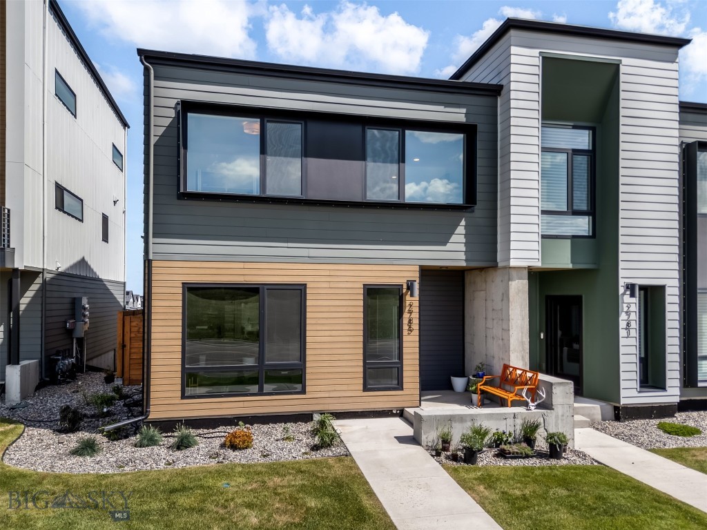 Set against the backdrop of mountain views and abundant natural light, this exceptional luxury condo redefines modern mountain living in the heart of Bozeman. Thoughtfully upgraded far beyond builder specifications, the residence blends Scandinavian-inspired design with warm organic materials, smart technology and sophisticated custom craftsmanship. Expansive Innotech euro-style windows frame the landscape while filling the home with sunshine year-round. Clean architectural lines are paired with rich custom solid walnut cabinet fronts, designer hardware, new statement lighting, walk in pantry and curated finishes that create a refined yet inviting atmosphere. The chef’s kitchen features a gas range, glass rinser and high-end sink and faucet, while the dining area has been enhanced with a bar and beverage refrigerator. Step outside to the private covered patio, which elevates the design for everyday living and effortless entertaining. The primary suite offers a true spa-like retreat with a luxurious steam shower, custom closet organization, vaulted ceilings and wool carpeting. Extensive custom storage solutions have been seamlessly integrated throughout the home for elevated functionality without compromising design. Outside, edible landscaping adds beauty and intention to the property, while a solar system enhances energy efficiency and sustainability. The heated oversized one-car garage has been transformed into a multifunctional extension of the home, complete with a custom workout loft and abundant storage. A full list of luxury upgrades is available. Rarely does a condo in this price range combine this level of architectural style, thoughtful customization, efficiency, and livability — all within one of Montana’s most sought-after communities.