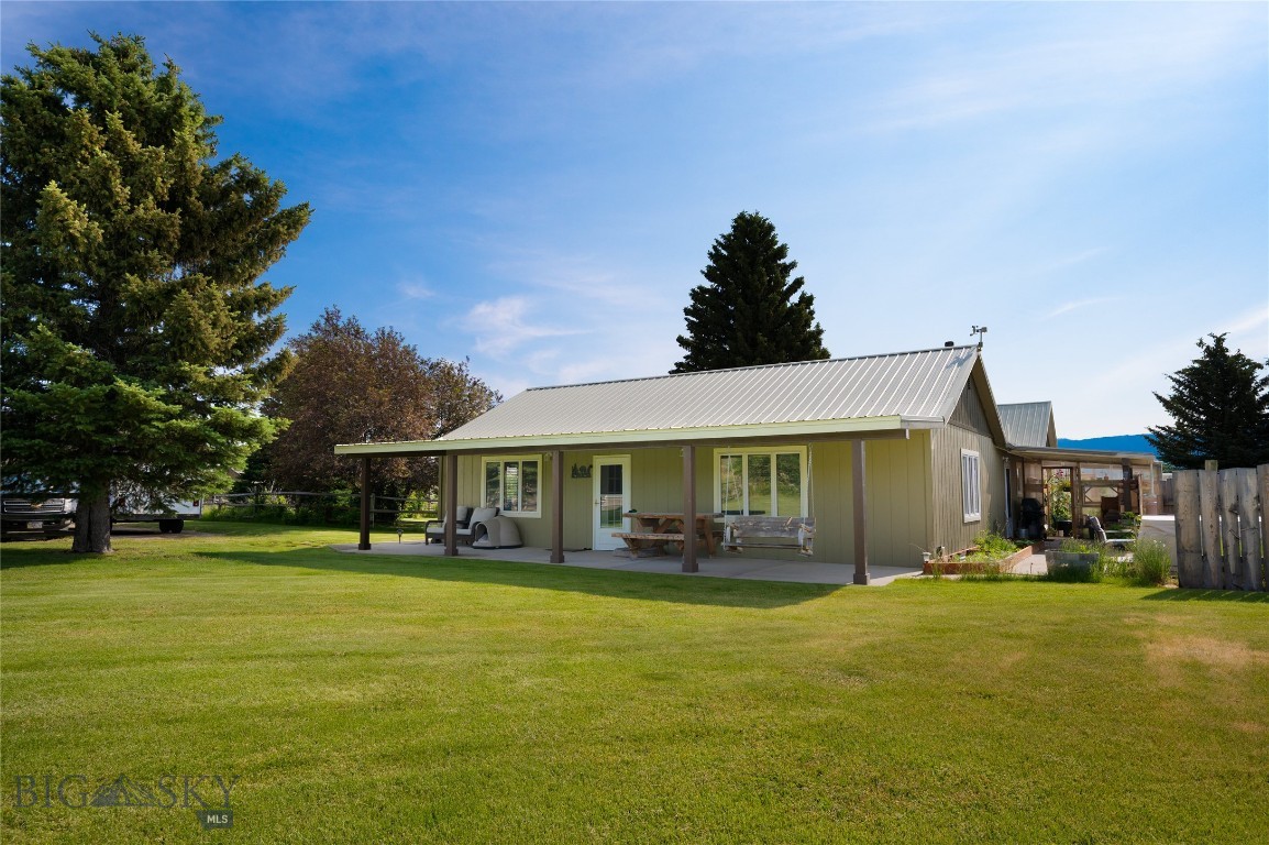 Montana living with room to roam. Set against open ranchland and just minutes from trails, lakes, and endless recreation, this 3 bed, 2 bath home on nearly 2 acres offers the space and flexibility to enjoy it all. The open layout features a remodeled kitchen with quartz countertops and newer appliances, a spacious primary suite, and a Blaze King wood stove complemented by propane forced-air heat.

Outside, the landscaped yard is irrigated by a second well, creating a well-maintained outdoor setting with room to relax or expand. A drip-irrigated greenhouse supports year-round growing, while the 24’ x 40’ shop with 30 & 50 amp power and attached carport provides ample space for equipment, hobbies, or recreational gear.

No HOA, no covenants, and paved access offer added convenience and flexibility. A well-rounded property with easy access to the best of Montana living.