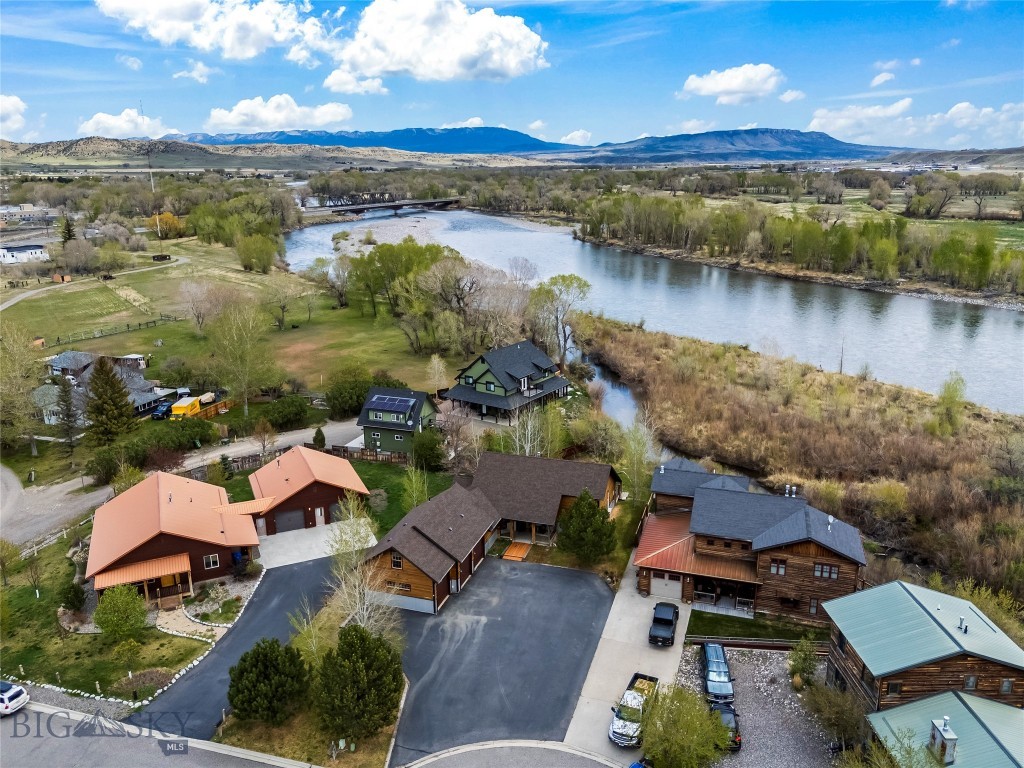 Located on a desirable cul-de-sac in Livingston, 213 Little Creek Bend is positioned at the confluence of Fleshman Creek and the Yellowstone River, offering close river proximity while remaining outside the 100 year floodplain. This home did not flood in 2022. It is offered turnkey, fully furnished and operates as a successful short-term rental accommodating up to 10 guests. Creek access allows for paddle boarding to and from the property and river. The boat ramp at Mayor’s Landing is a short distance away. Home features include multiple outdoor living areas with a large deck, creekside fire pit, and views of surrounding mountains. Interior finishes reflect a Montana style with comfortable gathering spaces. Suitable for use as an investment property, second home, or primary residence. Located approximately 75 minutes from Yellowstone National Park.